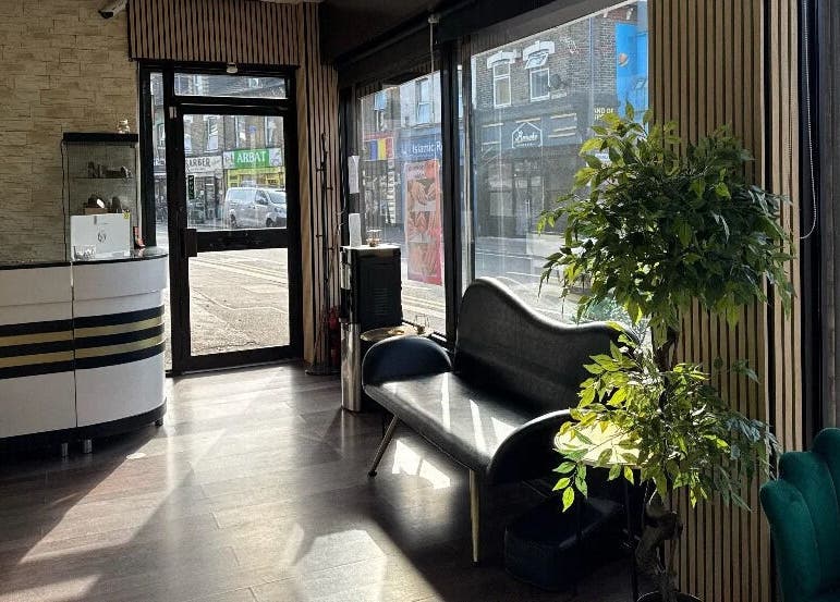 Spacious and bright lounge at Nuvia Beauty London, featuring elegant seating in London, England, GB.