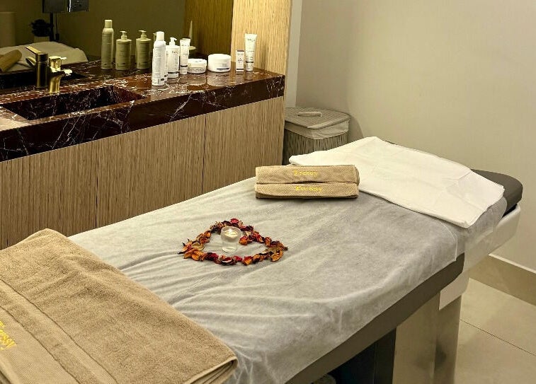 Luxurious treatment room at Tressy Spa, Riyadh, Riyadh Province, SA, featuring a massage table with cozy towels.