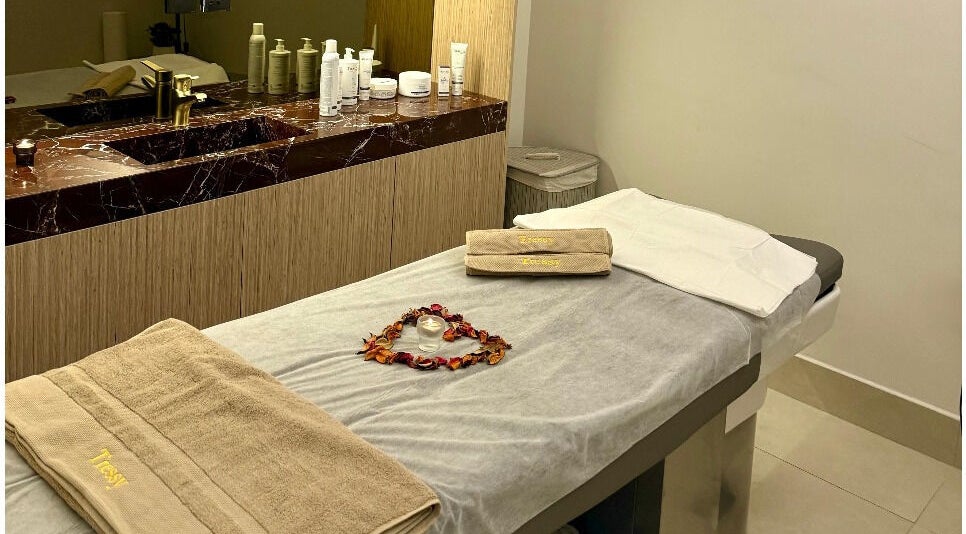 Luxurious treatment room at Tressy Spa, Riyadh, Riyadh Province, SA, featuring a massage table with cozy towels.