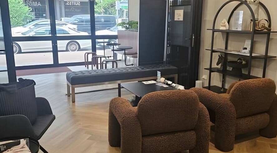 Cozy salon seating at Aestha Skin, Melbourne, Victoria, AU with plush chairs and modern decor.
