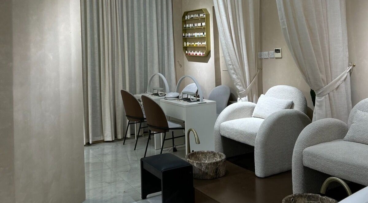 Pedicure and manicure area at Al Kadi Beauty Centre Salon & Spa, Sharjah, Sharjah, AE, featuring plush chairs.