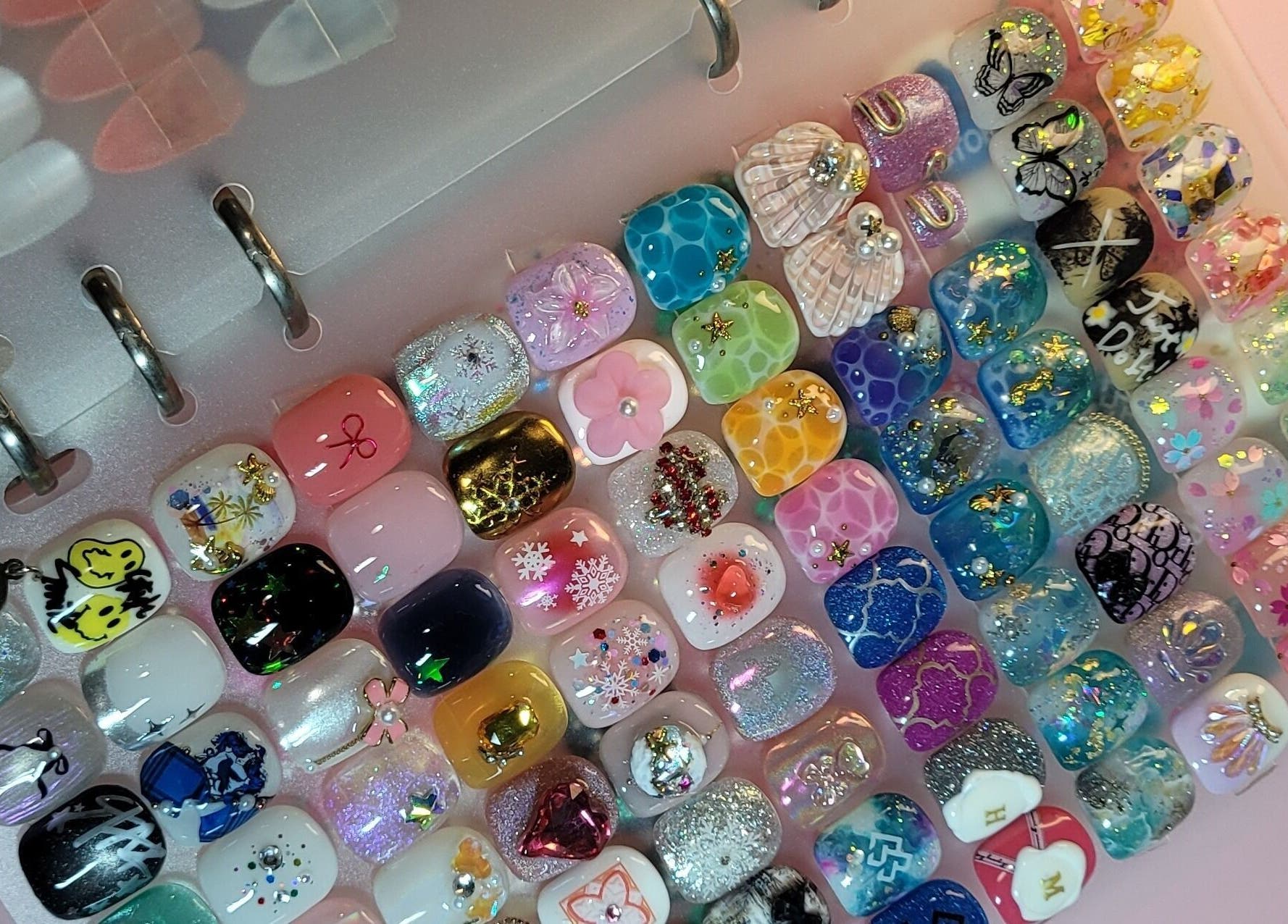 Vibrant nail art designs at Natural Hues, Yeronga, Queensland, AU, showcasing diverse creativity and style.