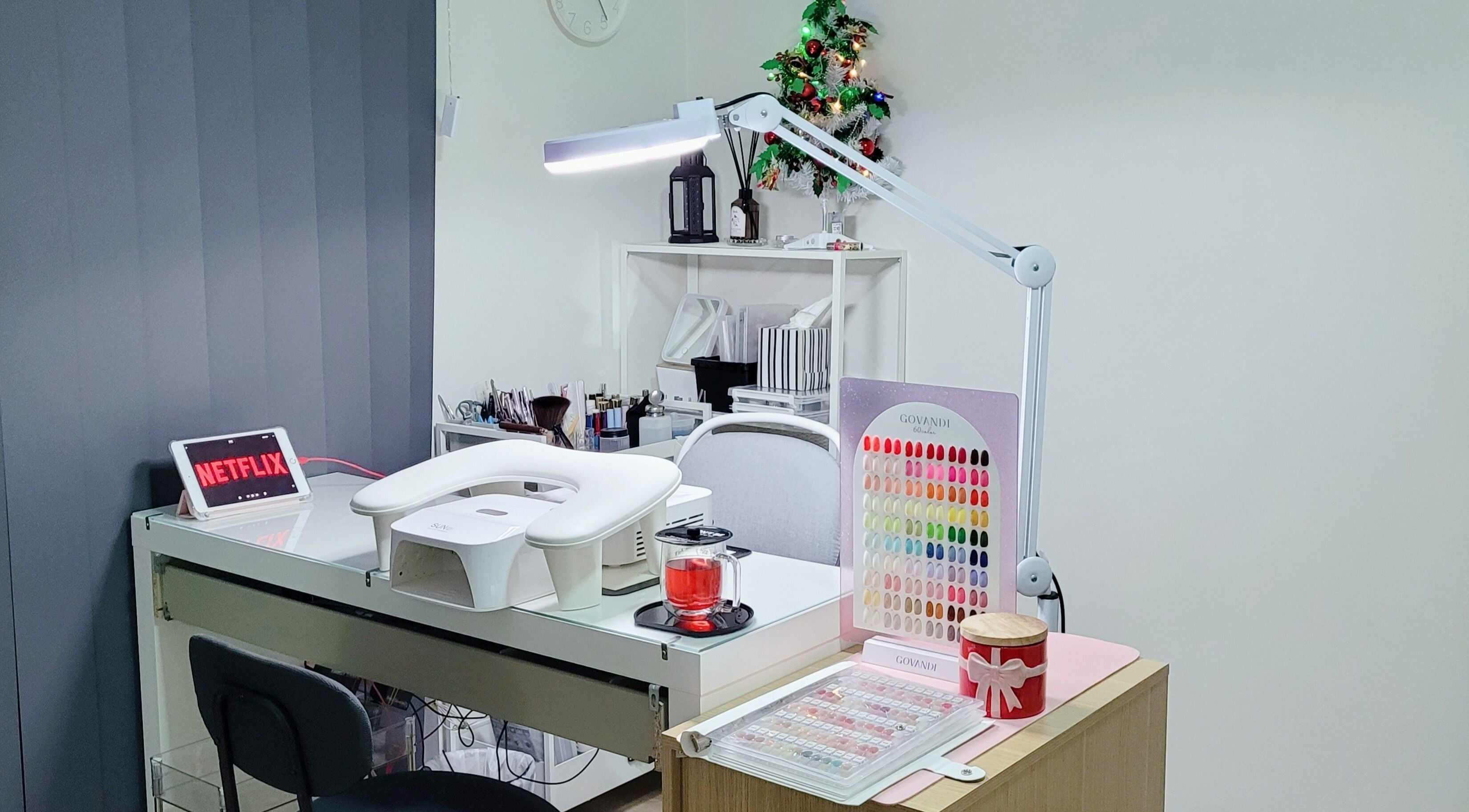 Natural Hues nail salon in Yeronga, Queensland, AU features a stylish manicure station with vibrant decor.