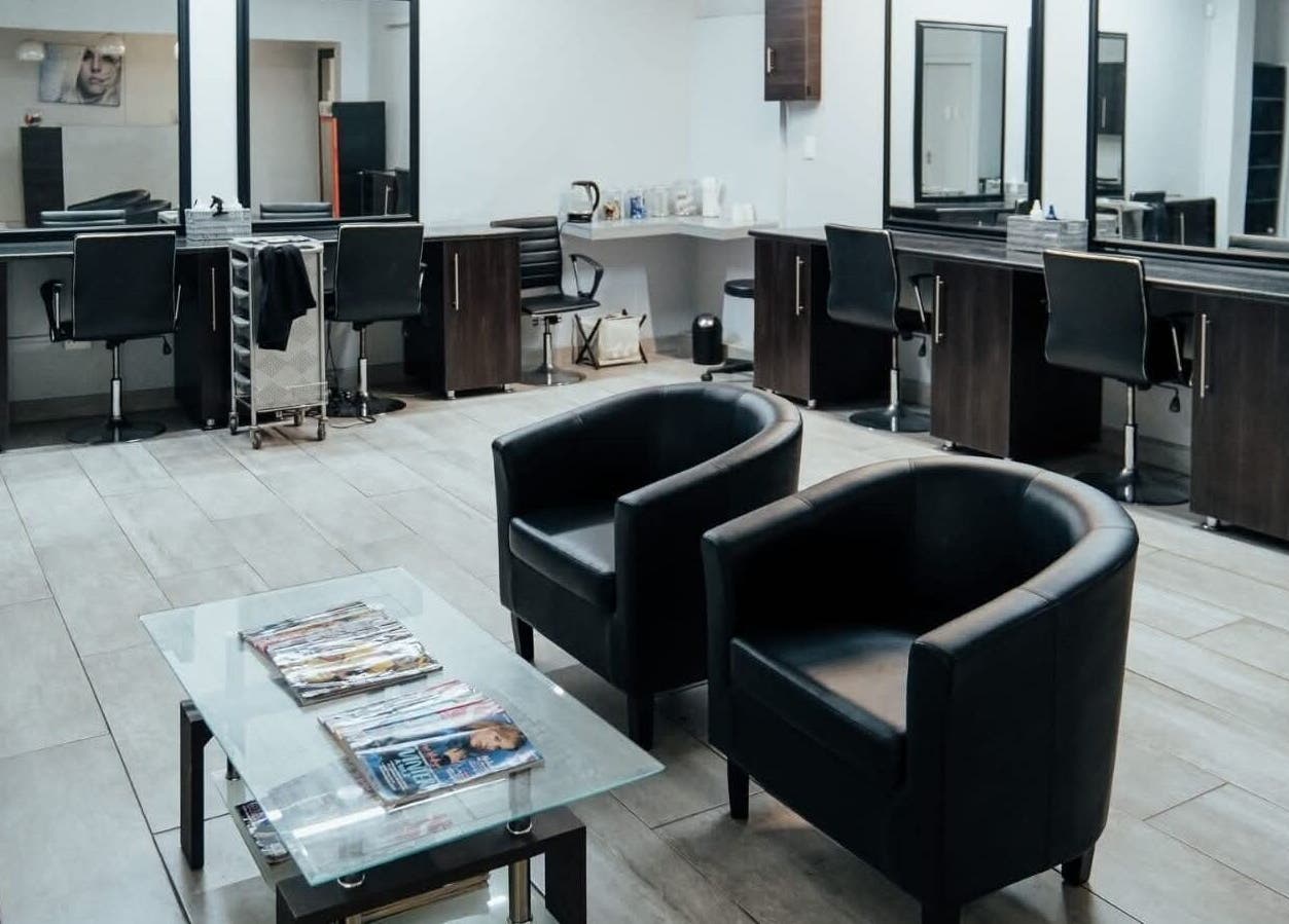 Chic interior of Celicia's Hair Studio in Vereeniging, Gauteng, ZA with stylish chairs and mirrors.