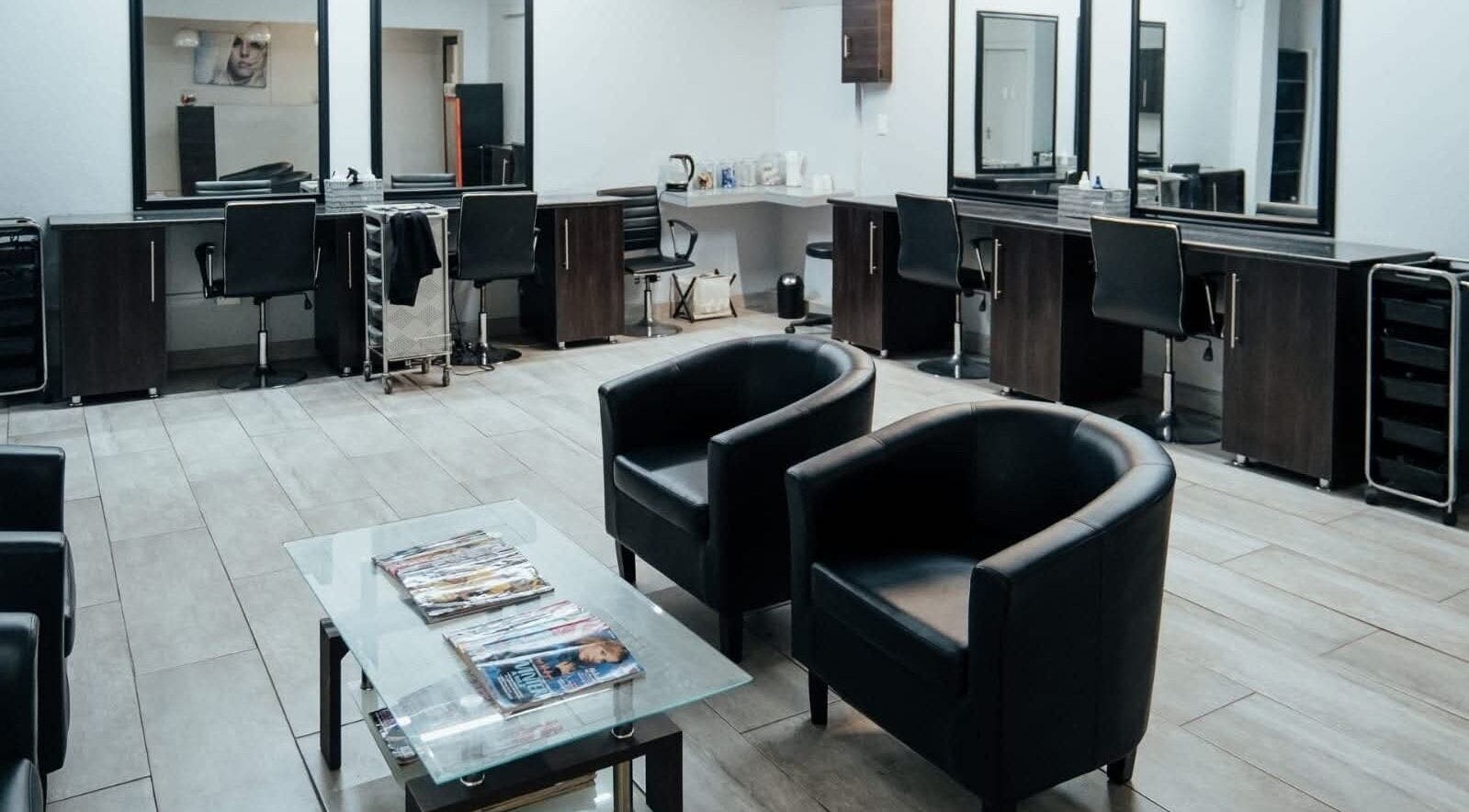 Chic interior of Celicia's Hair Studio in Vereeniging, Gauteng, ZA with stylish chairs and mirrors.