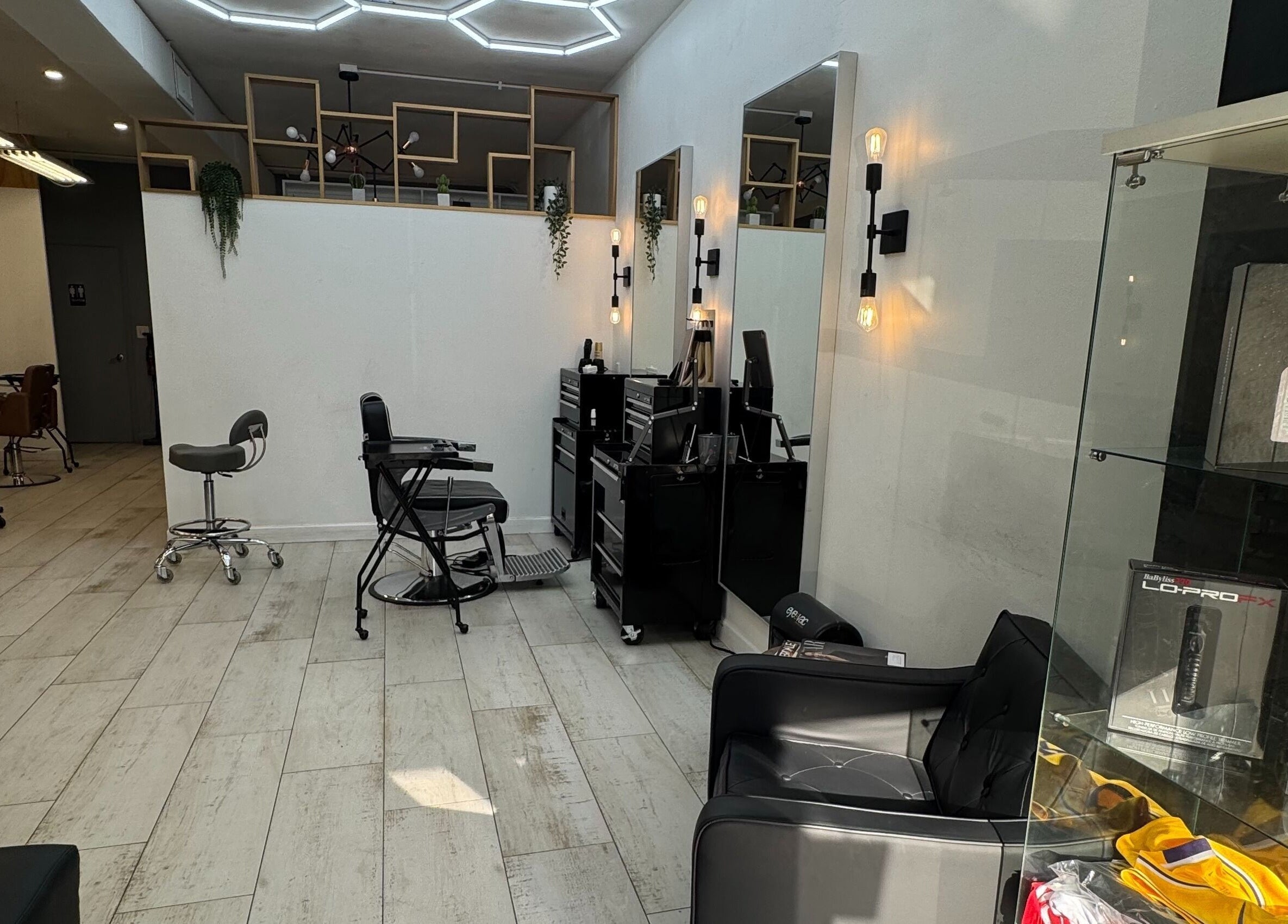 Stylish interior of Hair Lab Studio Salon in Fort Lauderdale, FL, US, showcasing modern hairstyling stations.