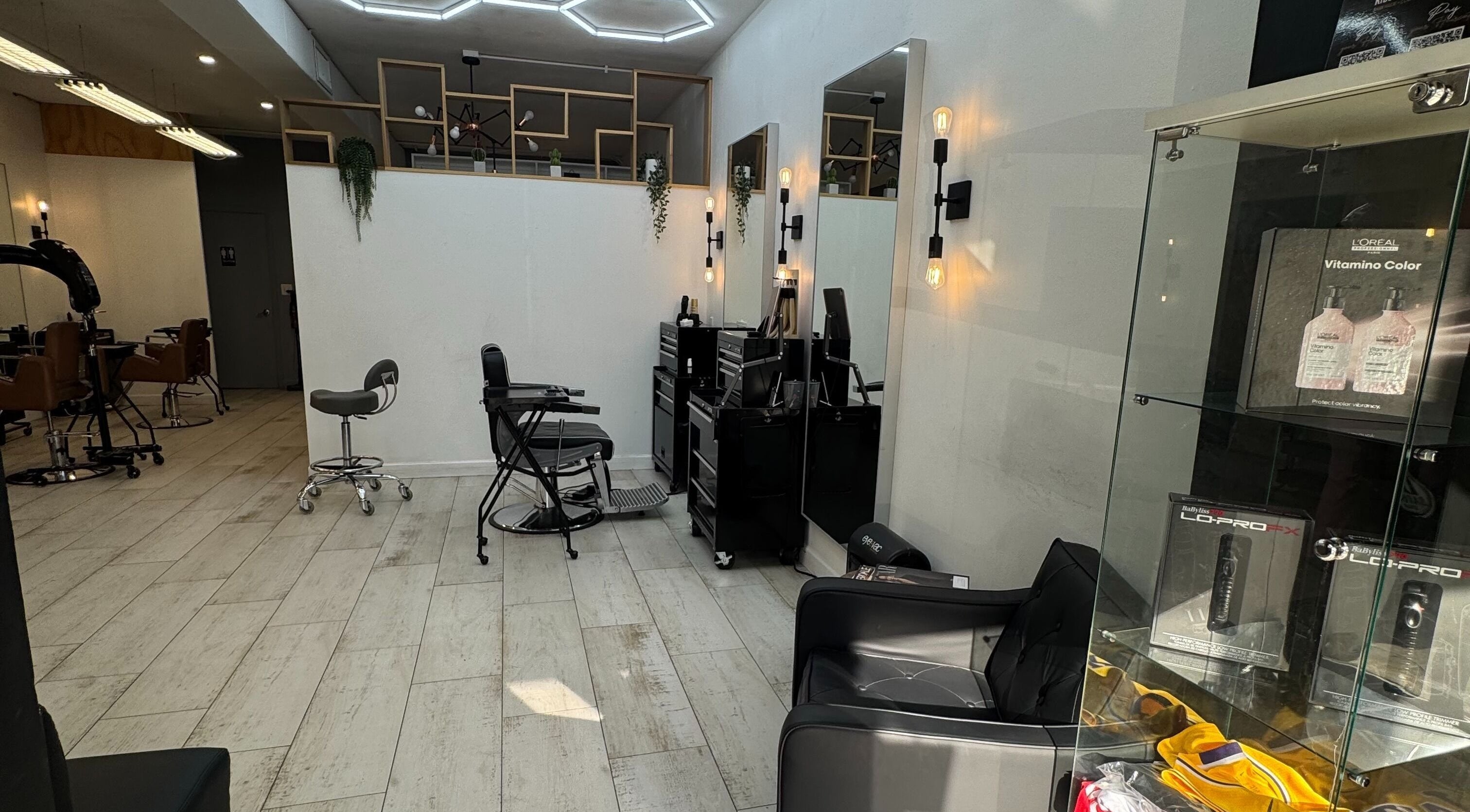 Stylish interior of Hair Lab Studio Salon in Fort Lauderdale, FL, US, showcasing modern hairstyling stations.