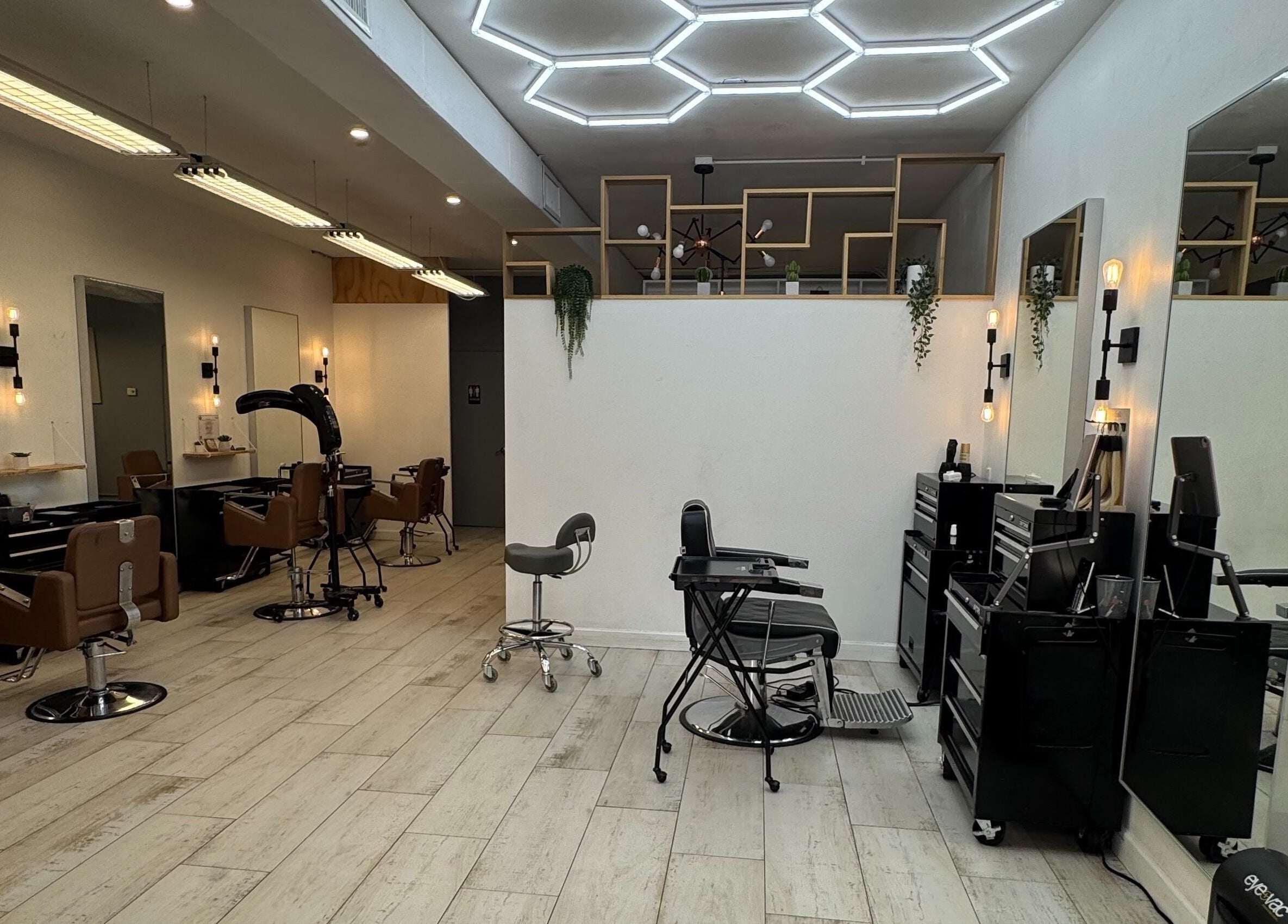 Interior of Hair Lab Studio Salon in Fort Lauderdale, FL, US featuring stylish chairs and contemporary lighting.
