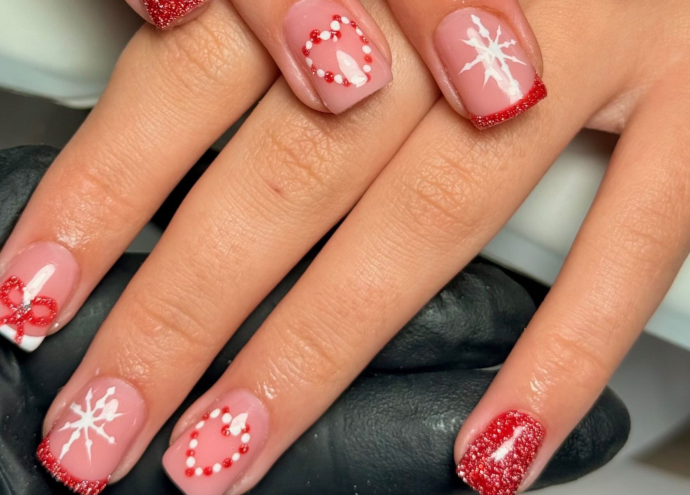 Festive red nail art at naileditbyjadee, located in Barnoldswick, England, GB. Perfect for holiday styling.