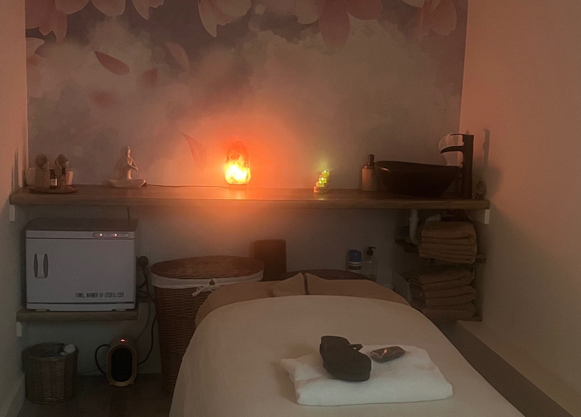 Tranquil massage room at Massage Therapy by Maria in London, England, GB with soft lighting and cozy decor.