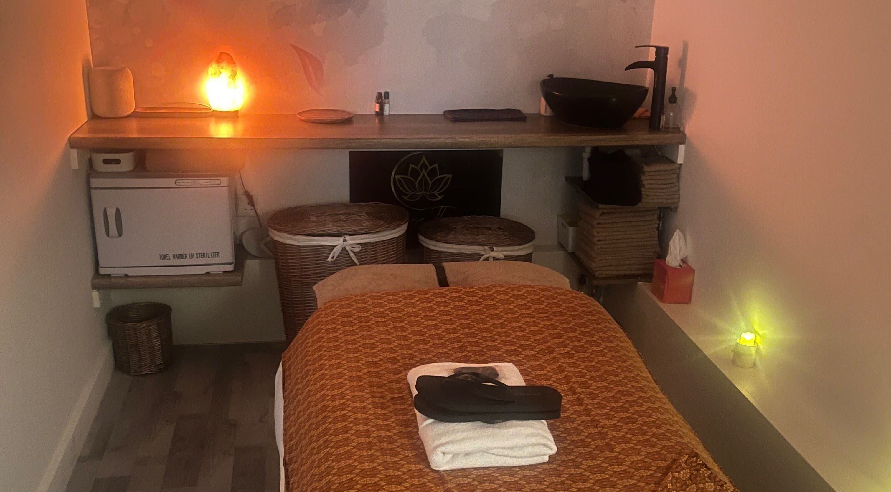 Cozy massage room at Massage Therapy by Maria, London, England, GB with soft lighting and plush linens.