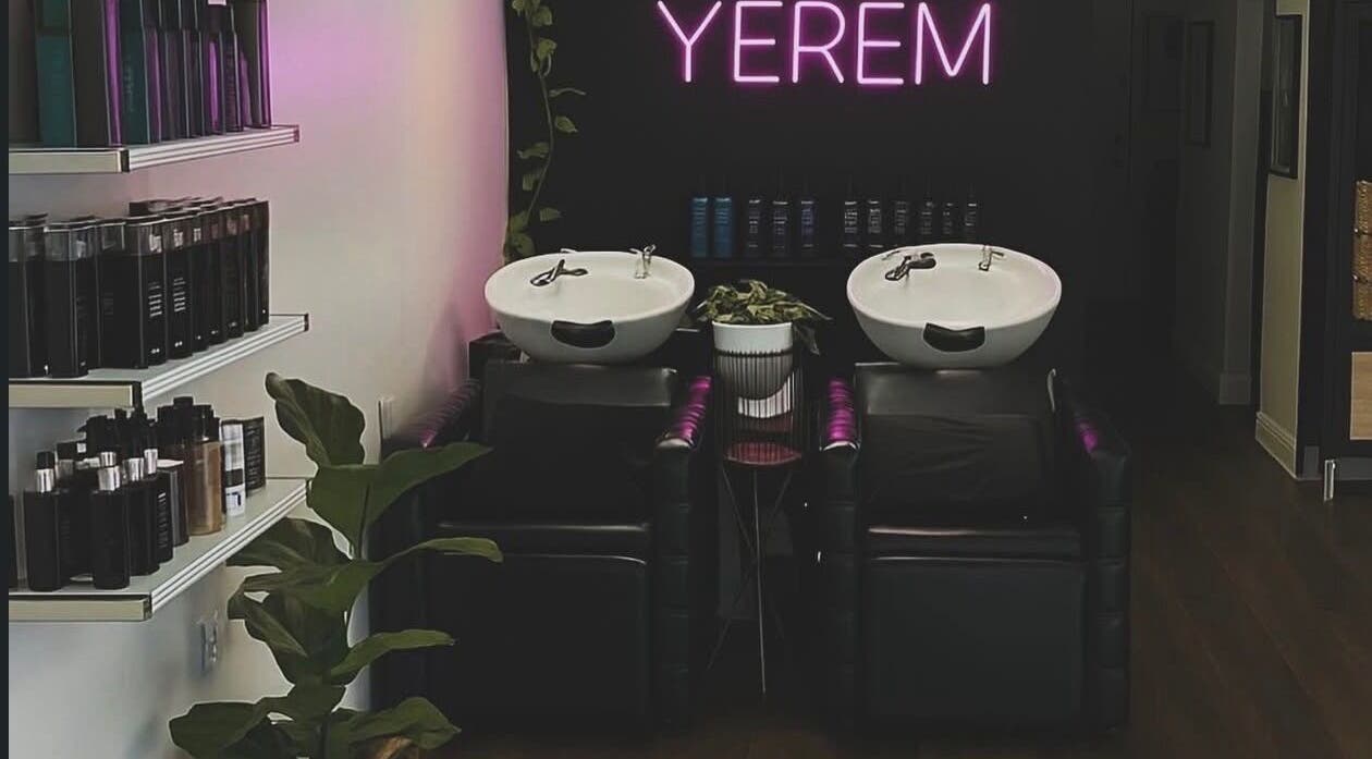 Modern salon wash station at YEREM' in Irvington, New Jersey, US, with sleek design and neon sign.