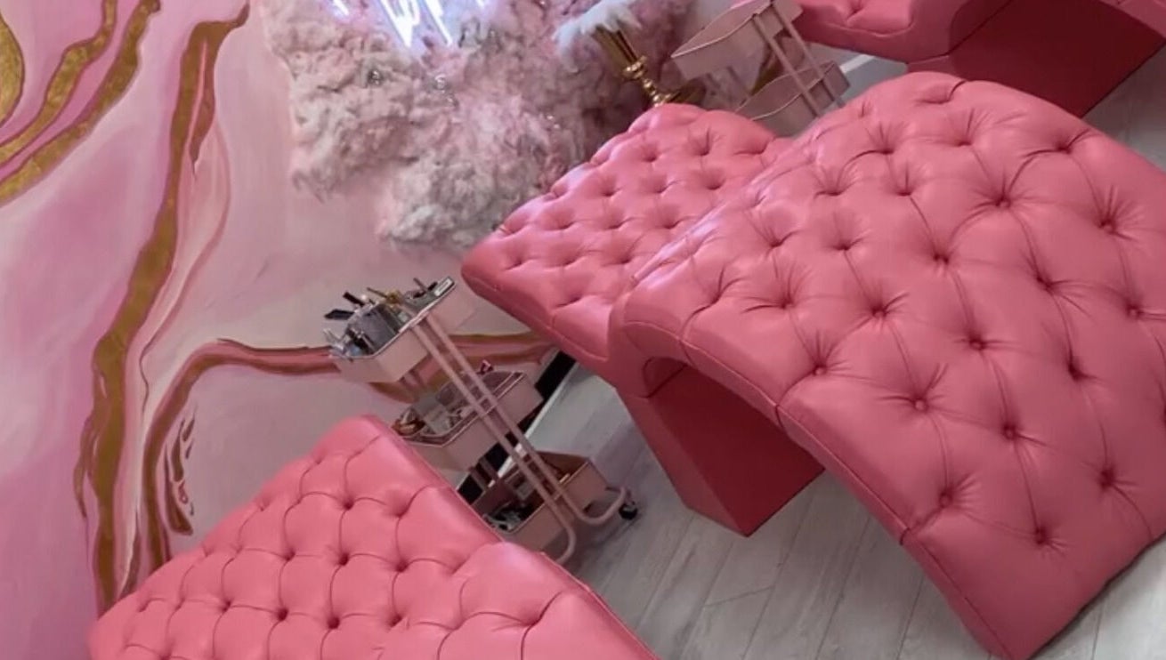 Luxurious pink recliners in Femelle Academy, Manchester, England, GB. Elegant beauty and wellness space.