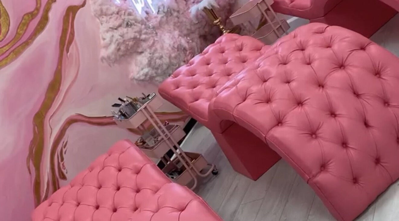 Luxurious pink recliners in Femelle Academy, Manchester, England, GB. Elegant beauty and wellness space.