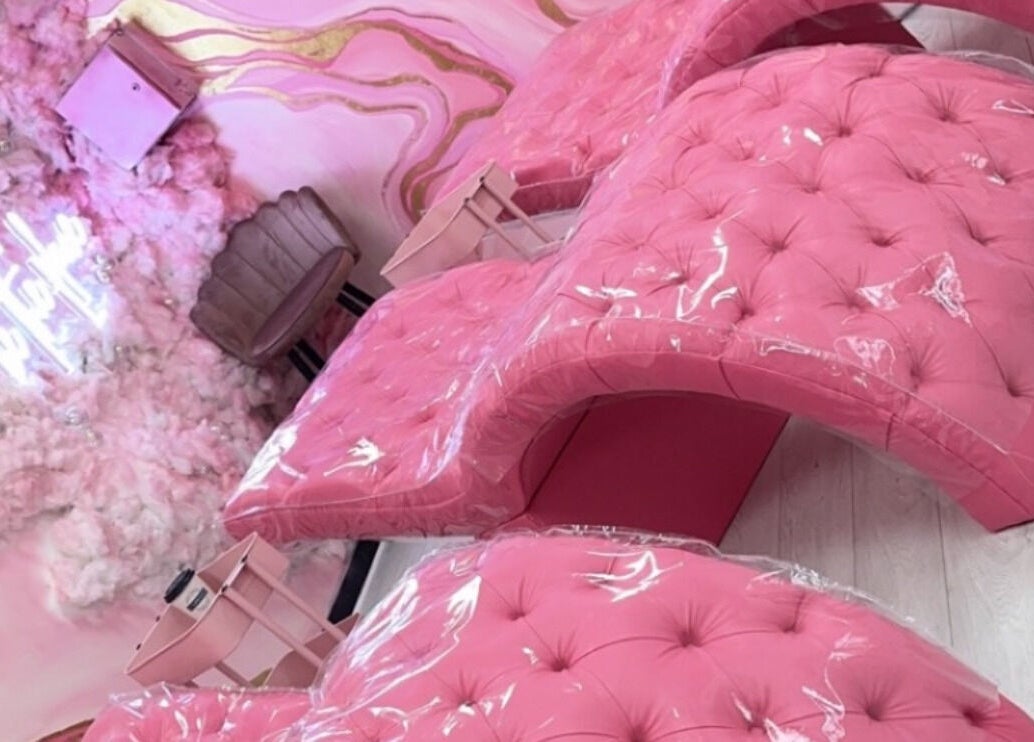 Chic pink salon chairs at Femelle Academy in Manchester, England, GB, perfect for luxury beauty treatments.