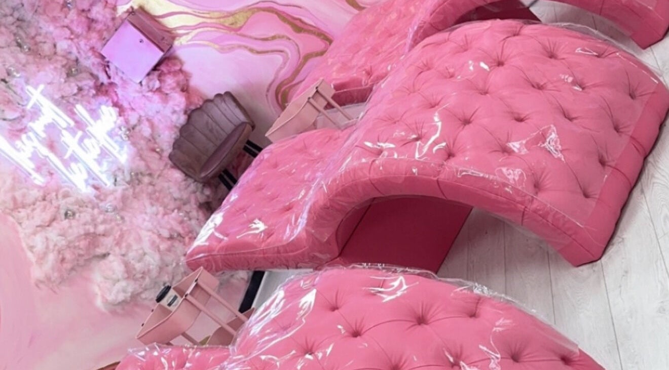 Chic pink salon chairs at Femelle Academy in Manchester, England, GB, perfect for luxury beauty treatments.