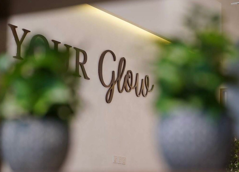 Welcome sign at Nails Glow- Al Ghadeer, Riyadh, Riyadh Province, SA, highlighting ambiance with plants in foreground.