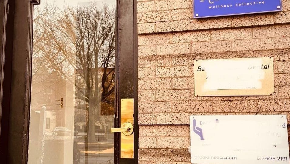 Entrance to Ethereal Path Wellness, brick facade in Brookline, Massachusetts, US.