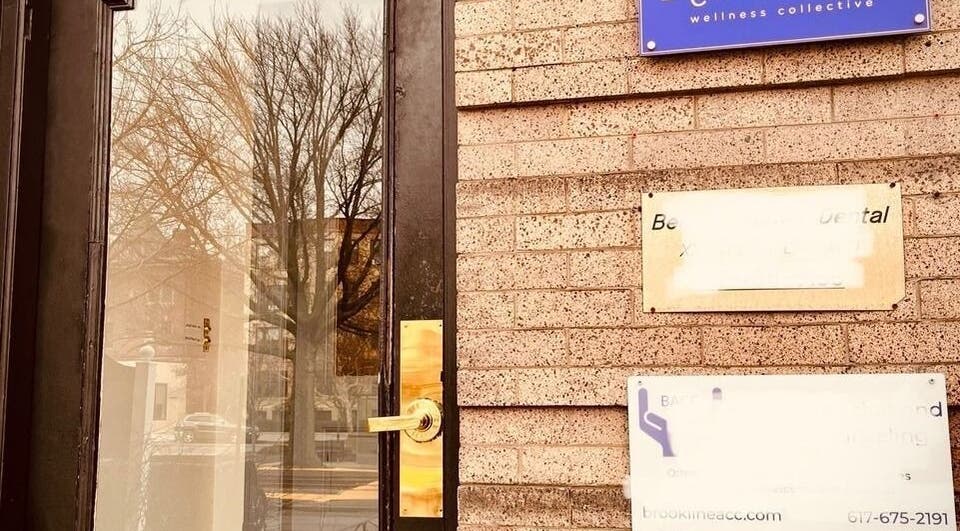 Entrance to Ethereal Path Wellness, brick facade in Brookline, Massachusetts, US.