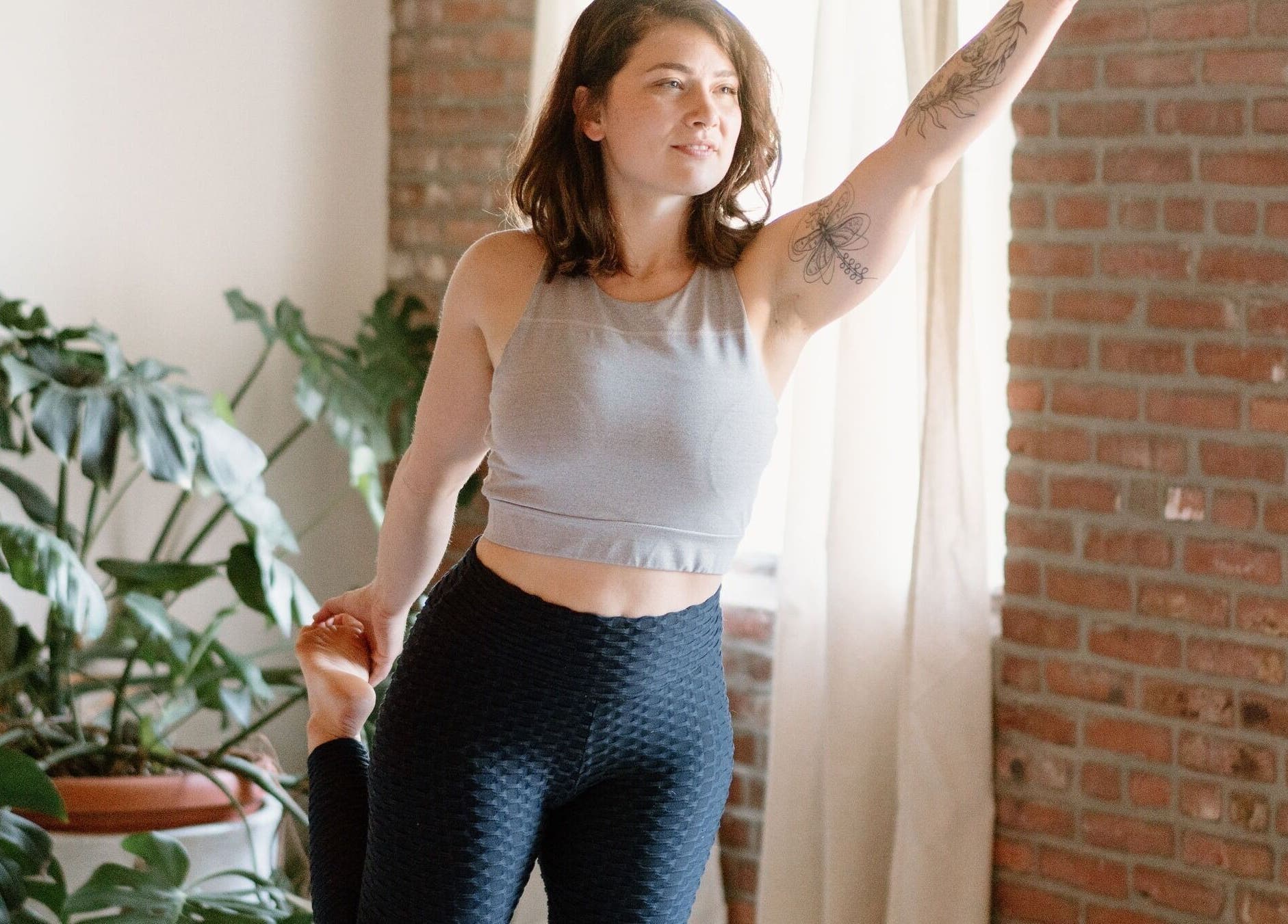 Person practicing yoga at Ethereal Path Wellness, Brookline, Massachusetts for relaxation and wellness.