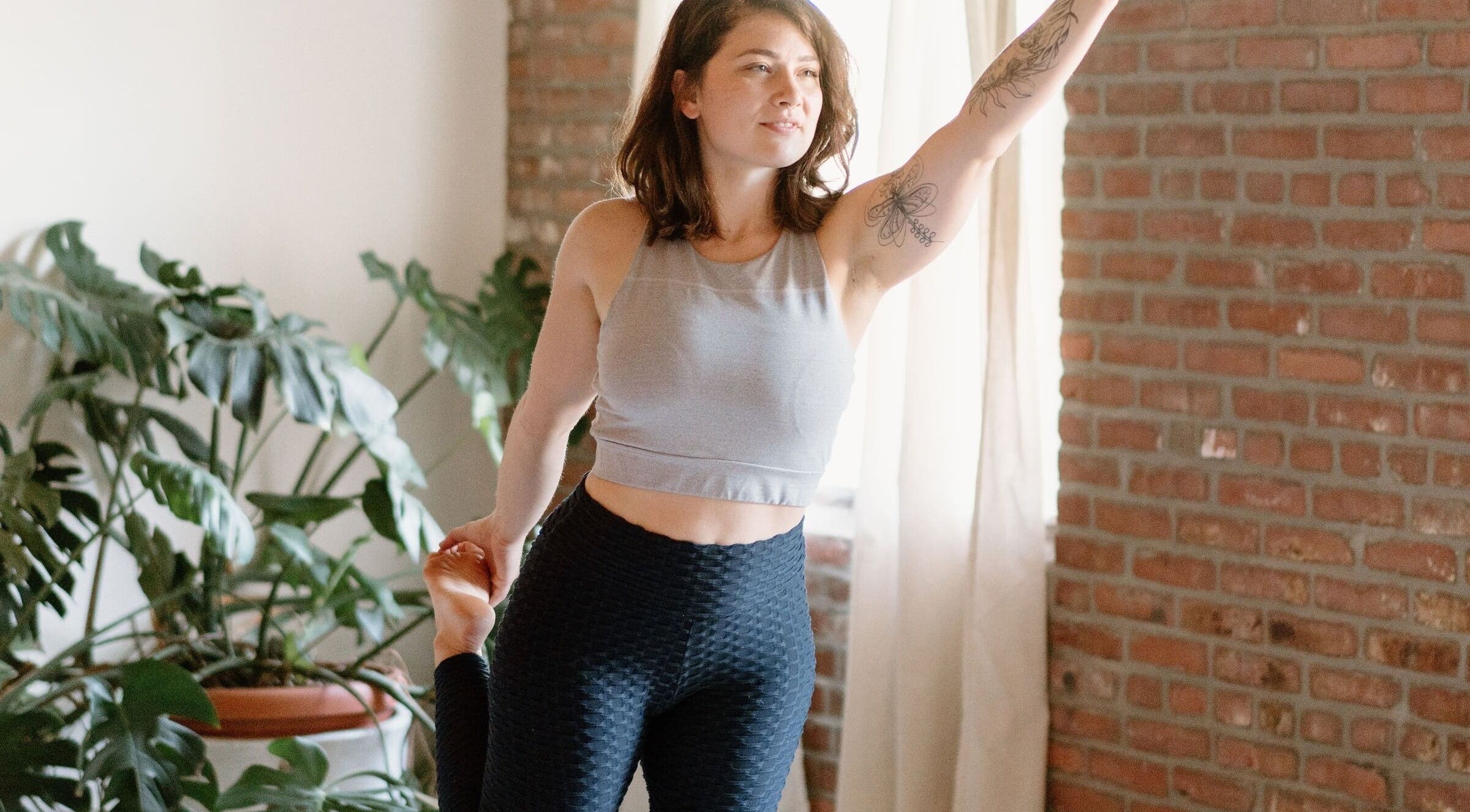 Person practicing yoga at Ethereal Path Wellness, Brookline, Massachusetts for relaxation and wellness.
