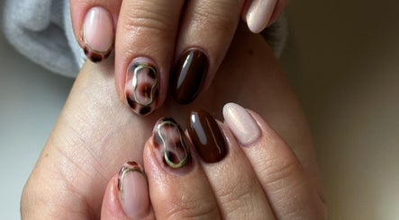 Stylish nail art with brown tones at Beauty Box Spa, Bracknell, England, GB. Perfect for a chic and modern look.