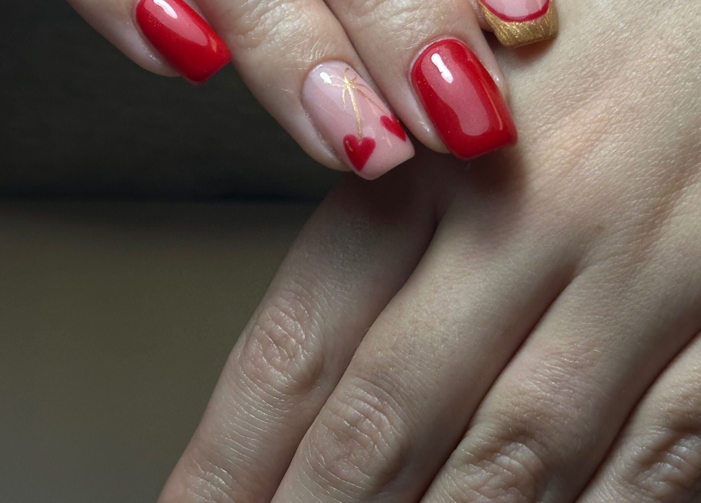 Red heart nail art at Beauty Box Spa, Bracknell, England, GB. Perfect for a trendy, chic look.