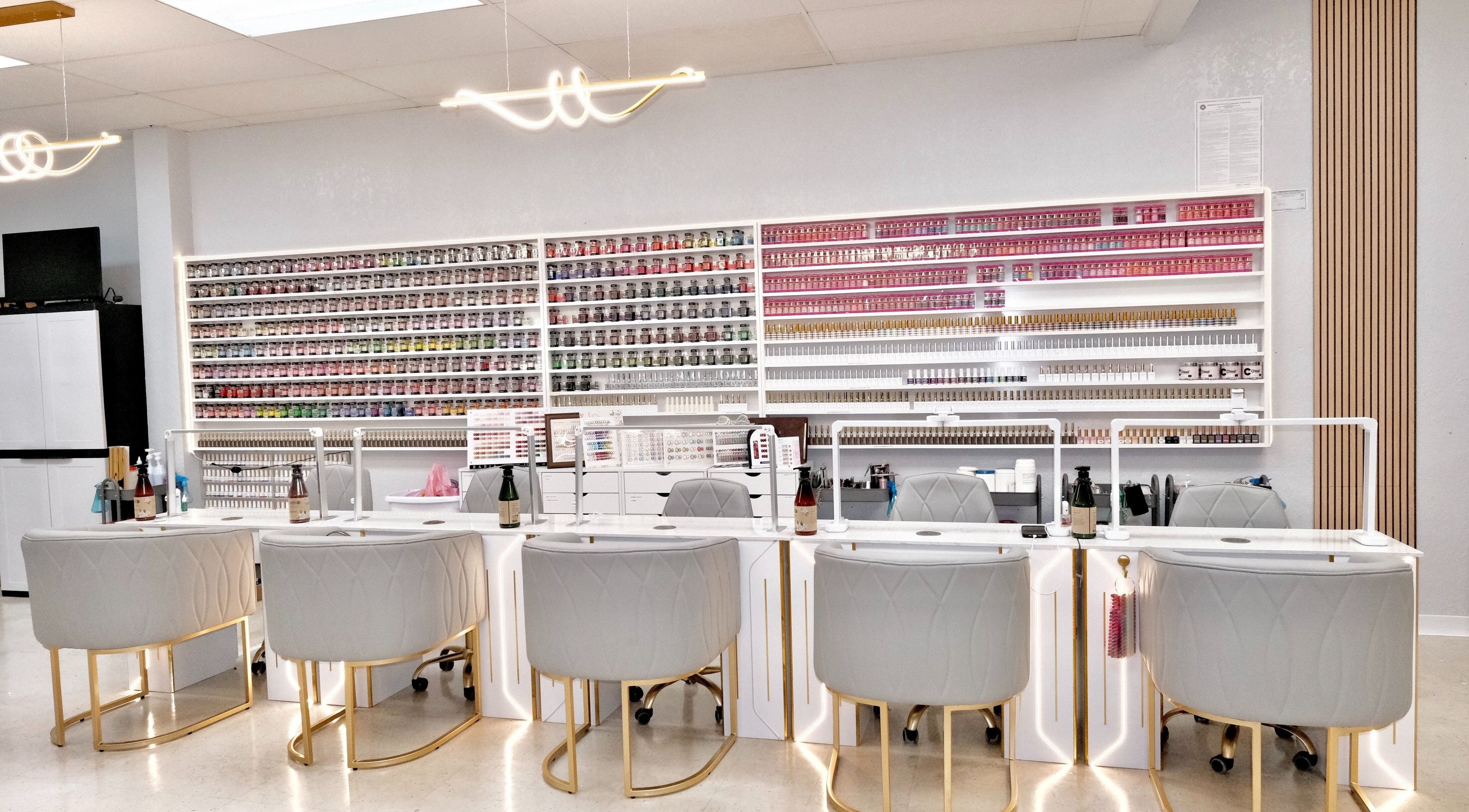 B Nails By Kris & Na in Bethany, Oklahoma, US, featuring a stylish nail station with a colorful polish display.