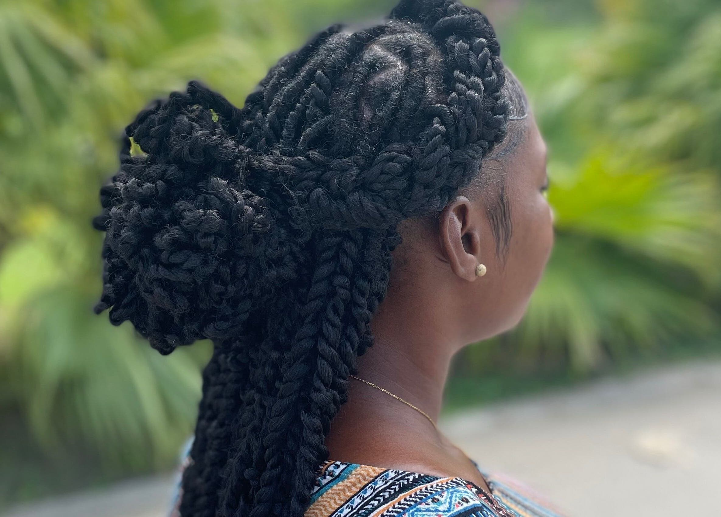 Intricate braided hairstyle from Kyng’s Hair Care in Saint John's, Saint John, AG offering expert styling.