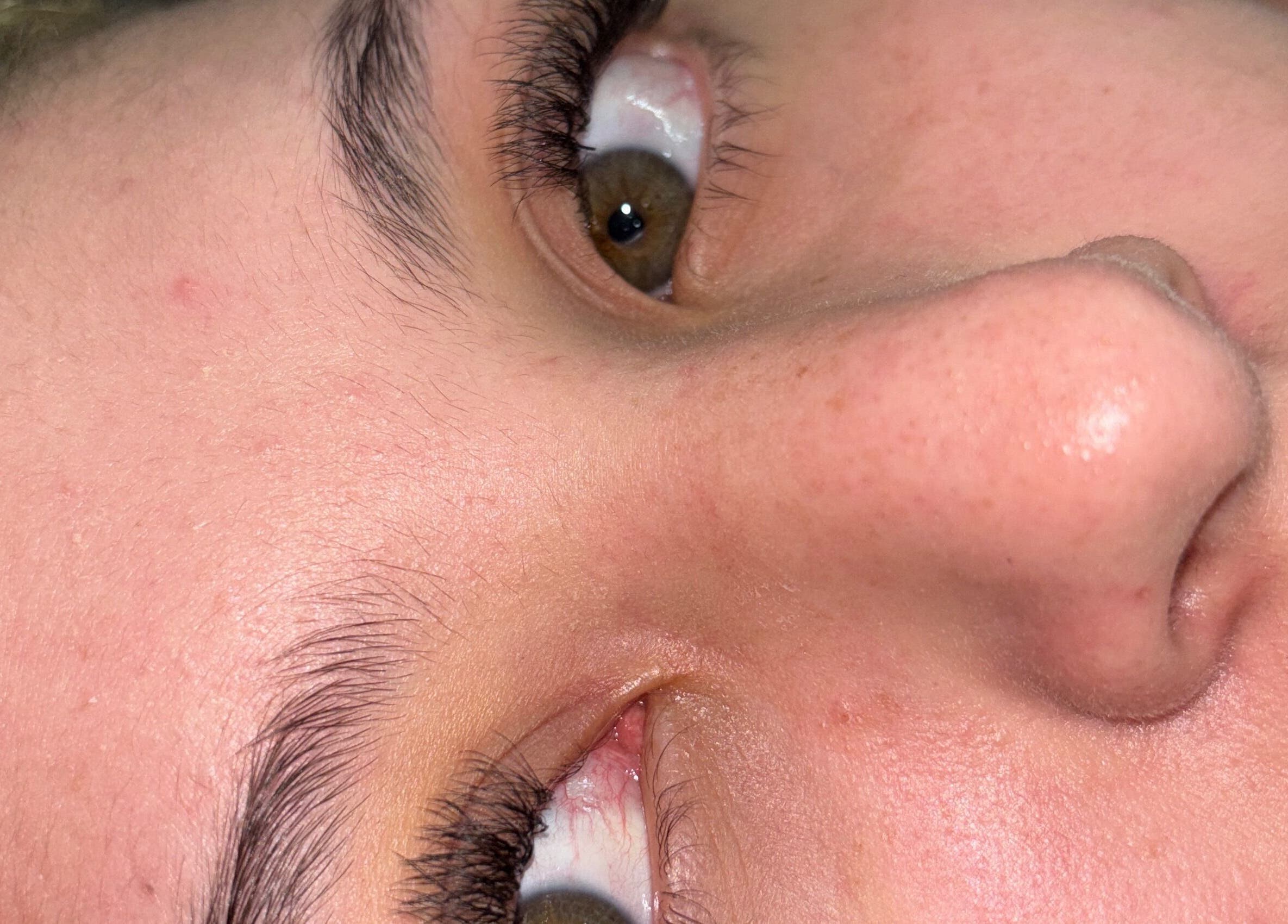 Close-up of lush eyelashes and smooth skin at Ale’s Nails, Medellín, Antioquia, CO.