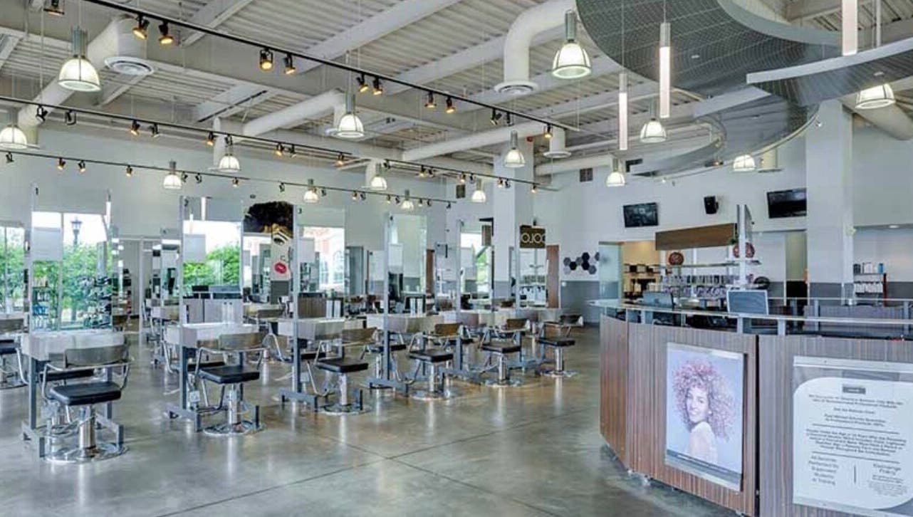 Spacious interior of LOURDEZ DOES HAIR in Cranston, Rhode Island, US, showcasing modern salon design.