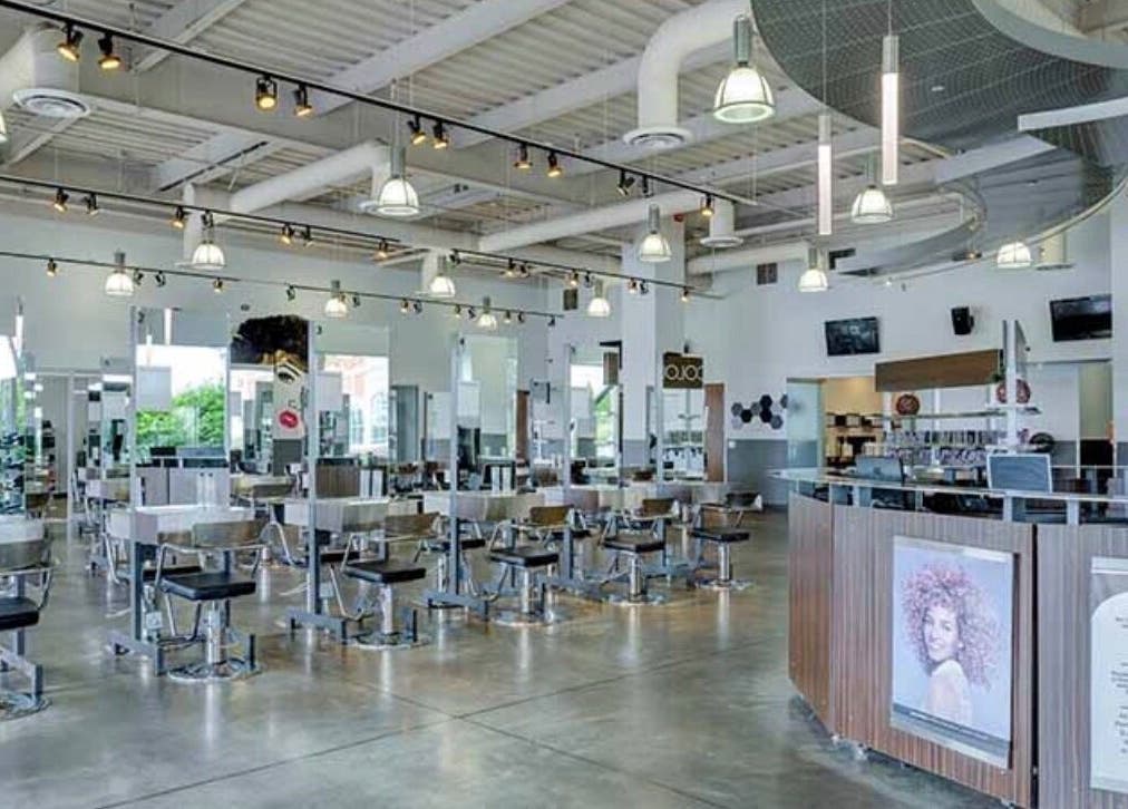 Spacious interior of LOURDEZ DOES HAIR in Cranston, Rhode Island, US, showcasing modern salon design.