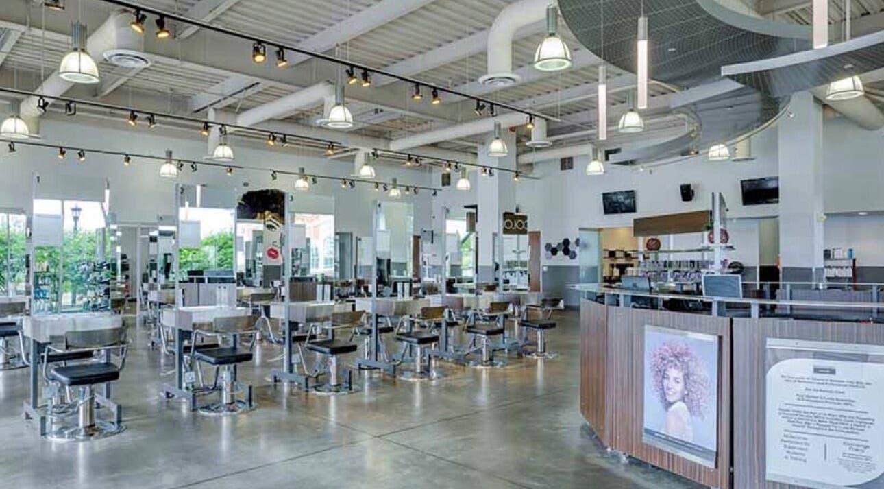 Spacious interior of LOURDEZ DOES HAIR in Cranston, Rhode Island, US, showcasing modern salon design.