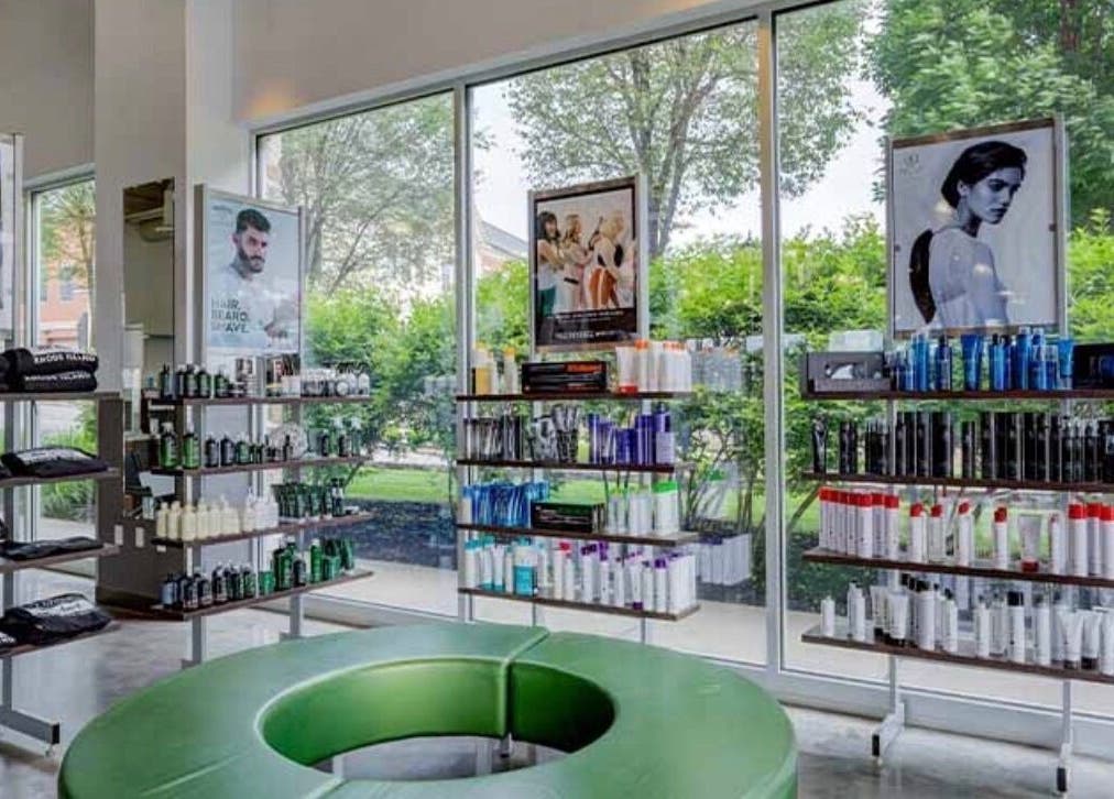 Bright, stylish interior of LOURDEZ DOES HAIR, Cranston, Rhode Island, US, showcasing premium haircare products.