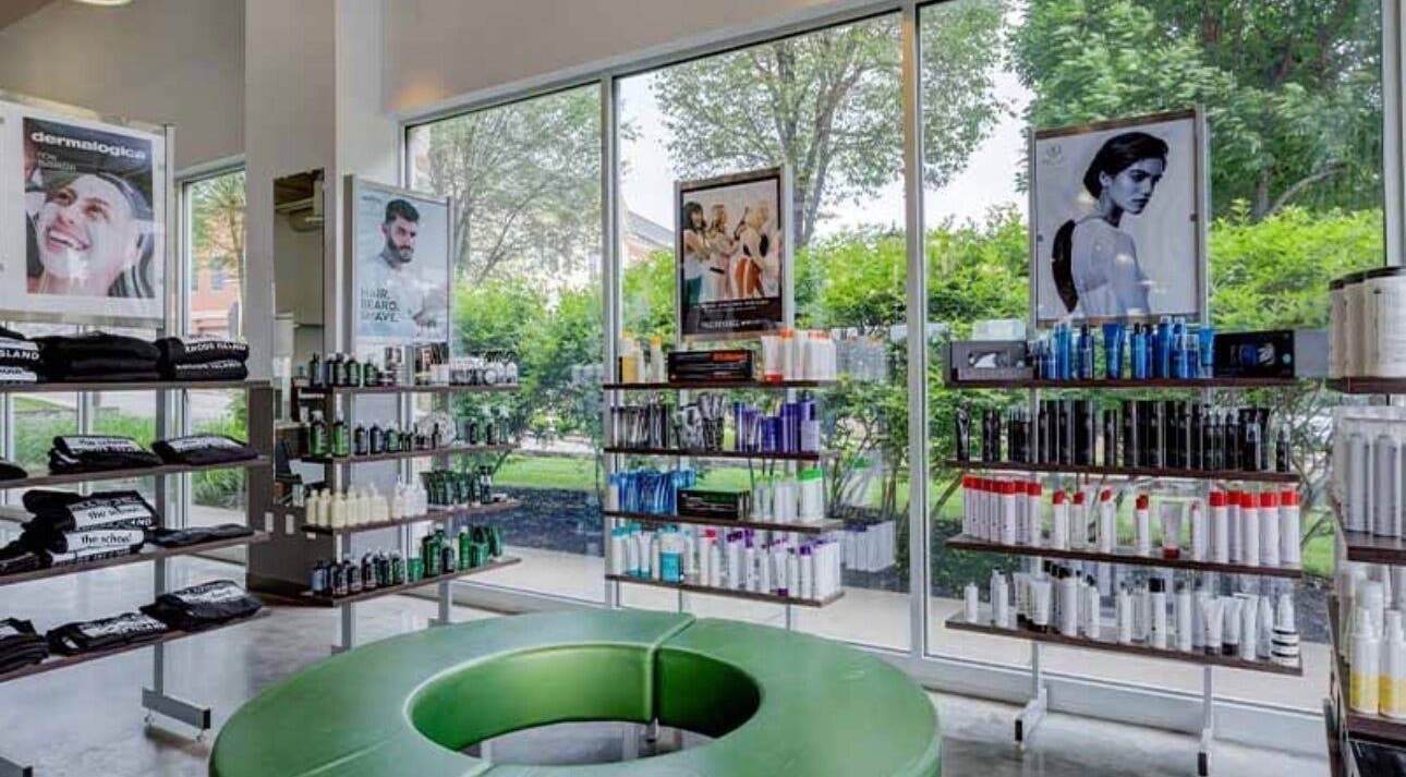 Bright, stylish interior of LOURDEZ DOES HAIR, Cranston, Rhode Island, US, showcasing premium haircare products.