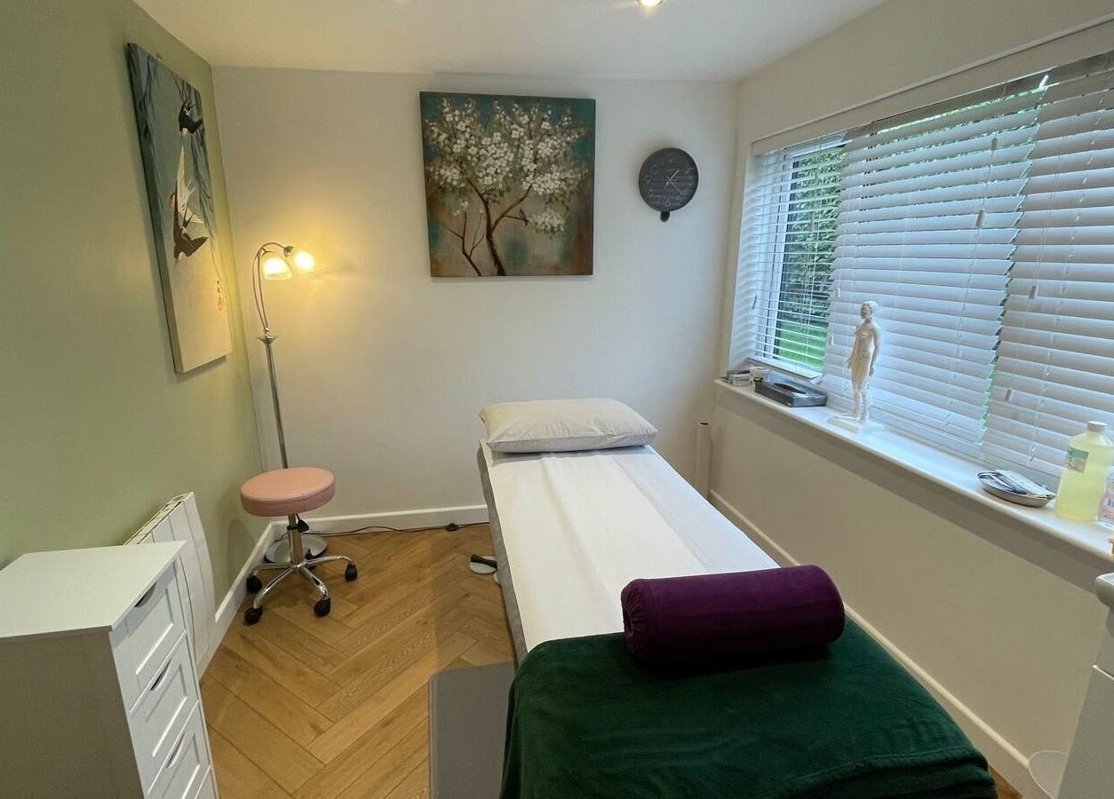 Calm treatment room at The Avenue Acupuncture Clinic, Worcester, England, GB, featuring a massage bed and decor.