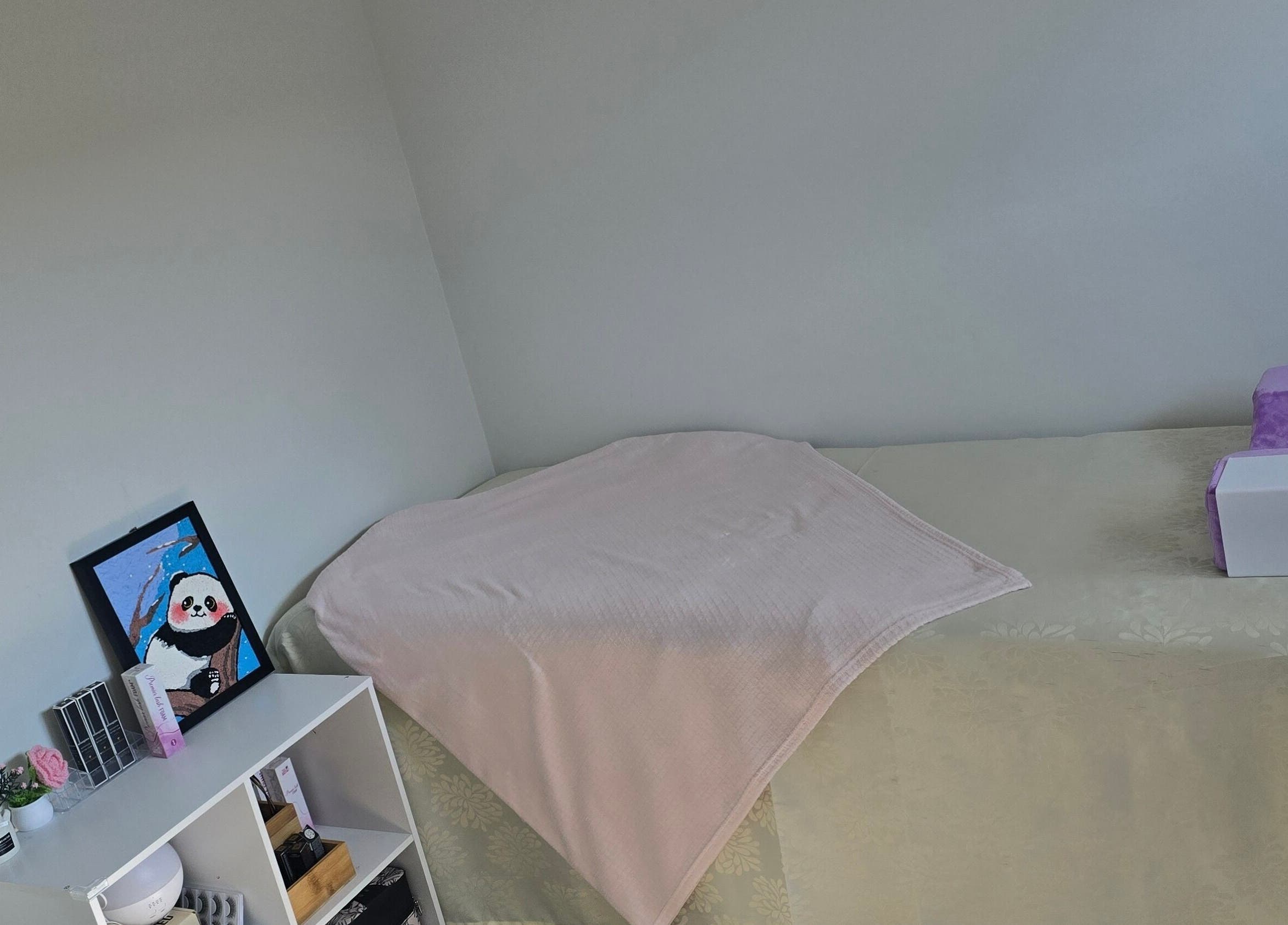 JLBeauty spa room with massage table and decor, Wentworthville, New South Wales, AU.