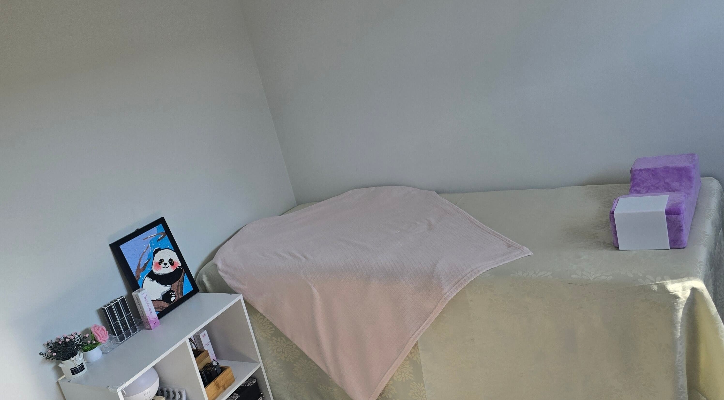 JLBeauty spa room with massage table and decor, Wentworthville, New South Wales, AU.