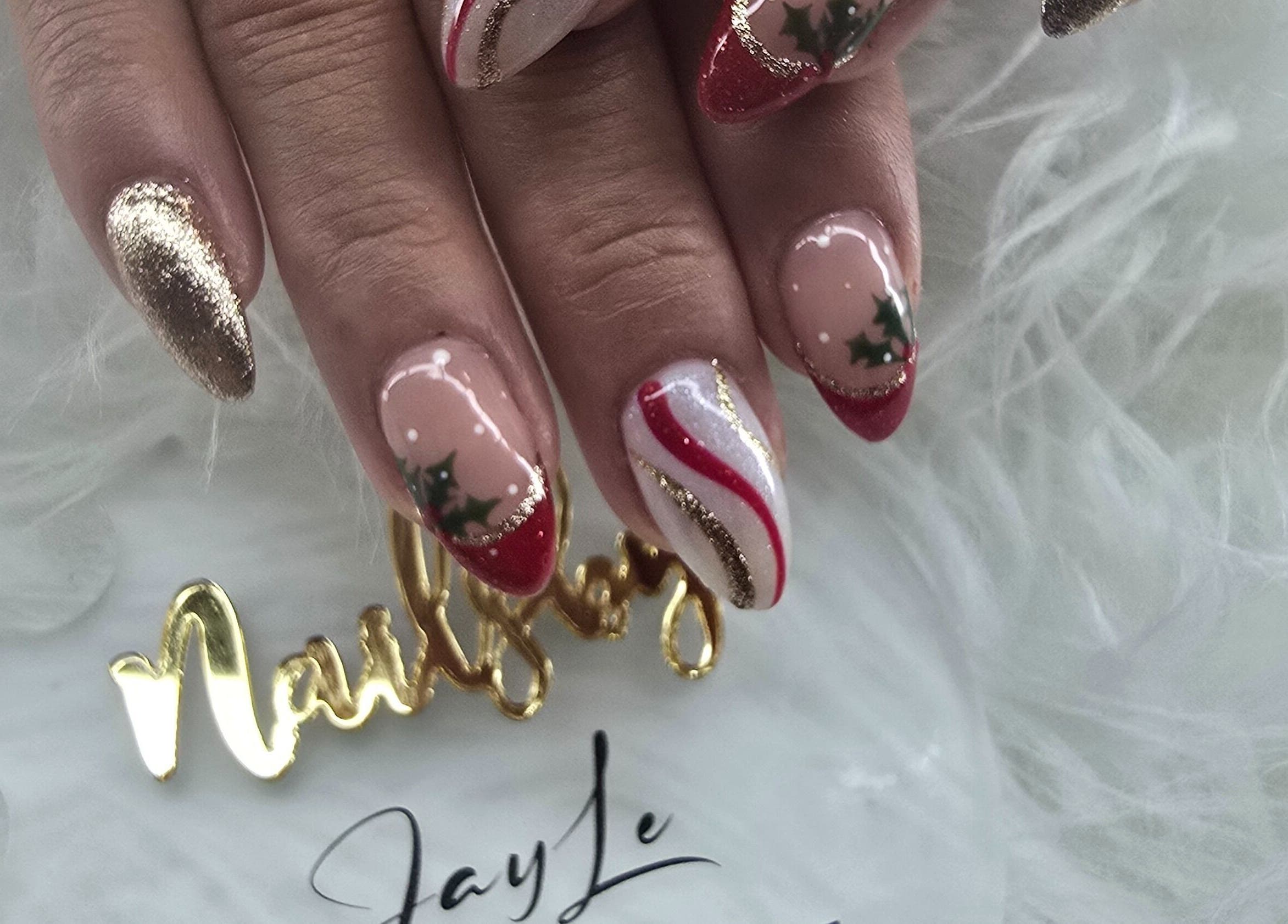 Beautiful festive nail art with red and gold accents at JLBeauty, Wentworthville, New South Wales, AU.