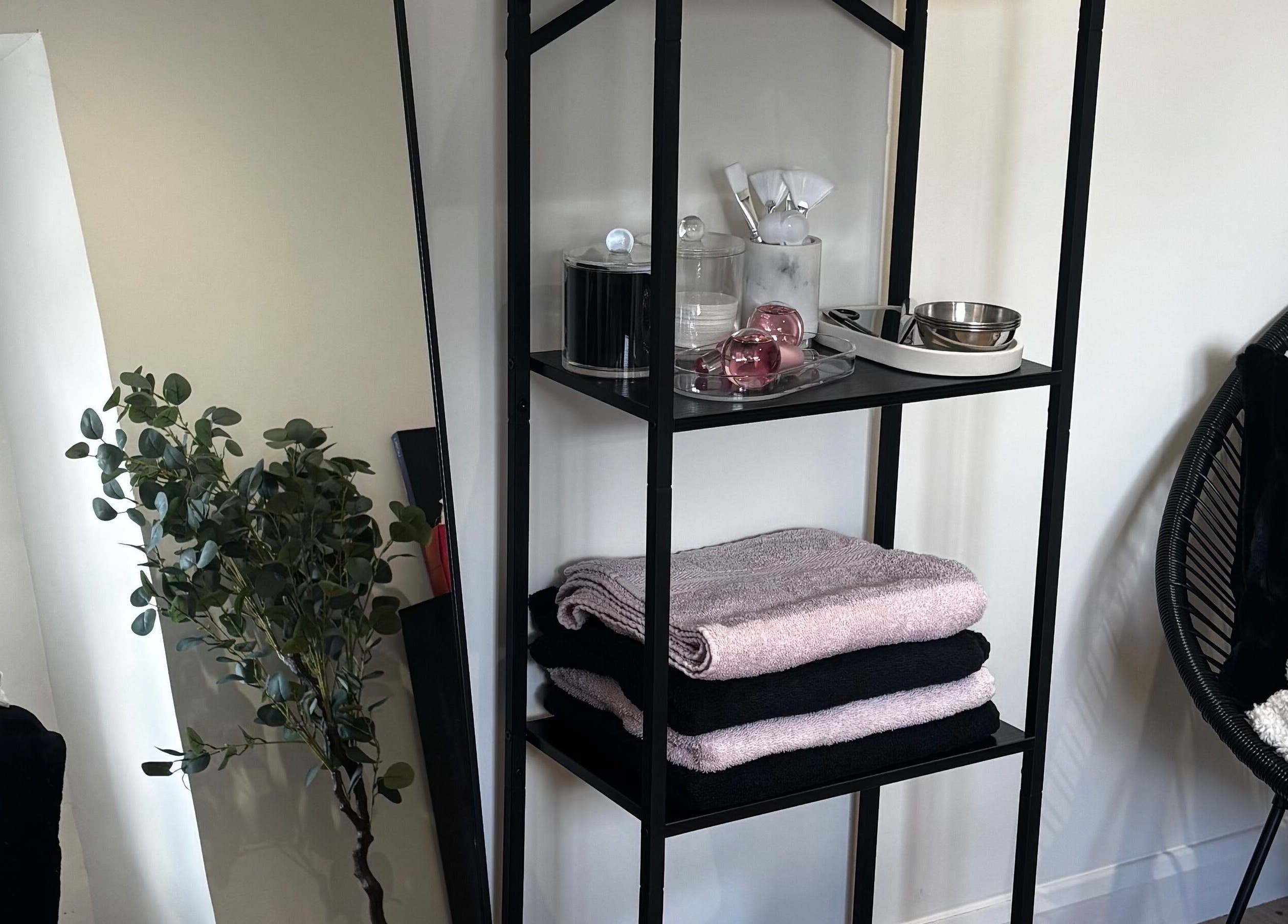 Elegant shelving with towels and spa items at LVD|BEAUTY, Kettering, England, GB, enhancing relaxation ambiance.
