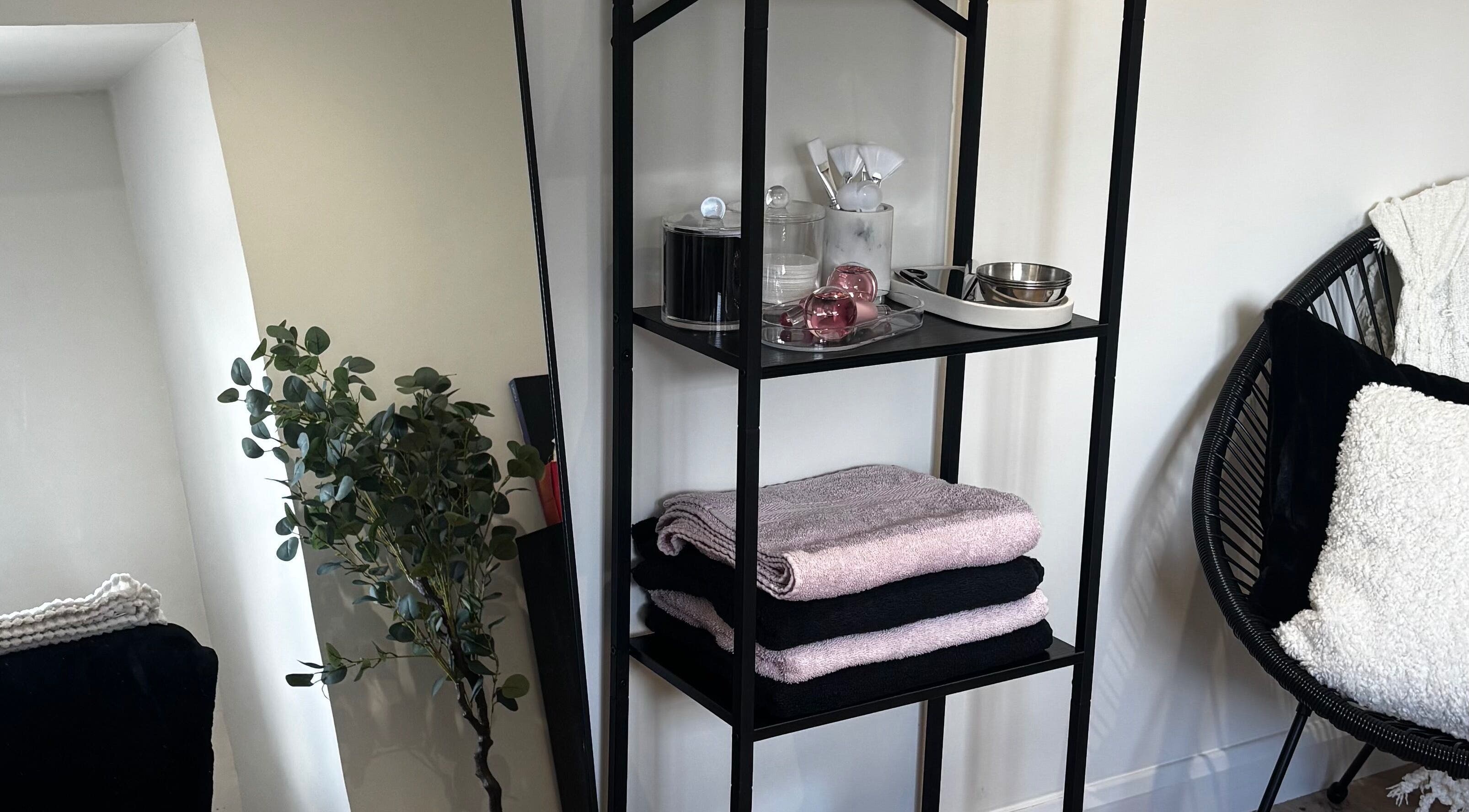 Elegant shelving with towels and spa items at LVD|BEAUTY, Kettering, England, GB, enhancing relaxation ambiance.