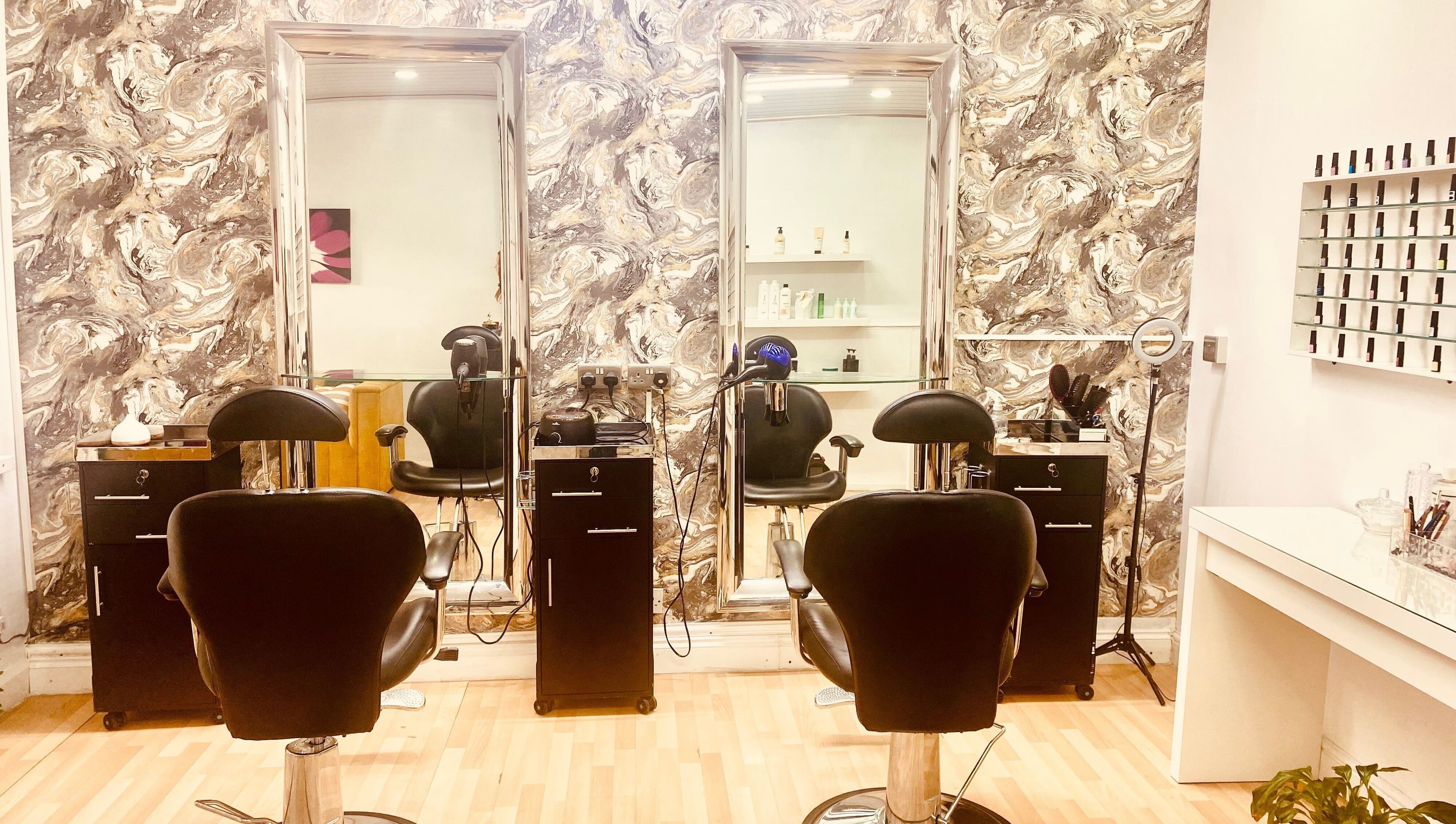 Stylish salon chairs and mirrors at Beauty Hub 131, Nelson, England, GB, showcasing modern elegance.