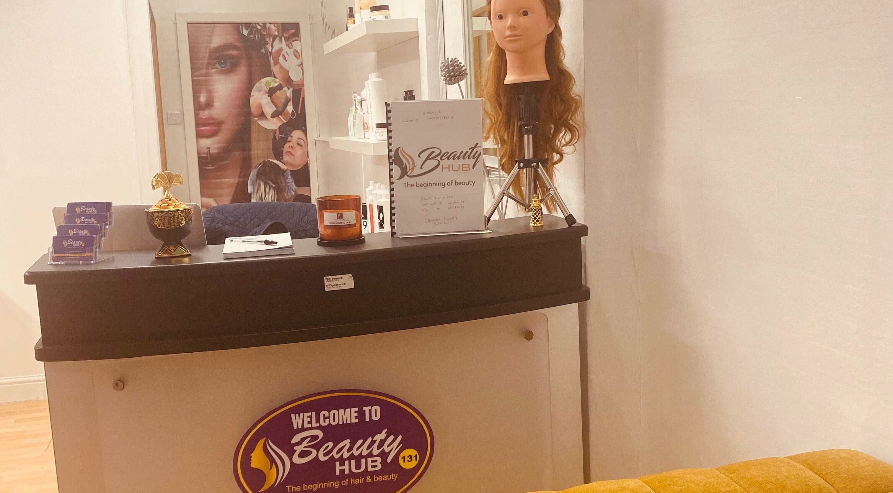 Reception area at Beauty Hub 131, Nelson, England, GB, showcasing welcoming decor and beauty items.