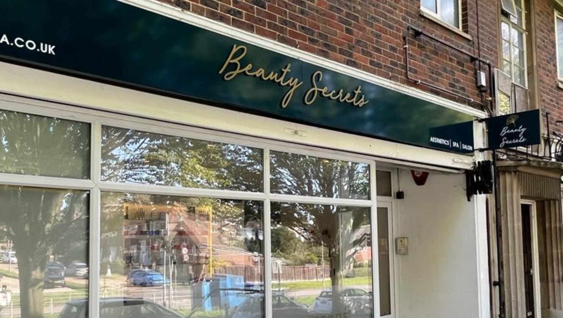 Sarelle Clinic Ltd storefront in Brighton And Hove, England, GB with elegant Beauty Secrets signage.