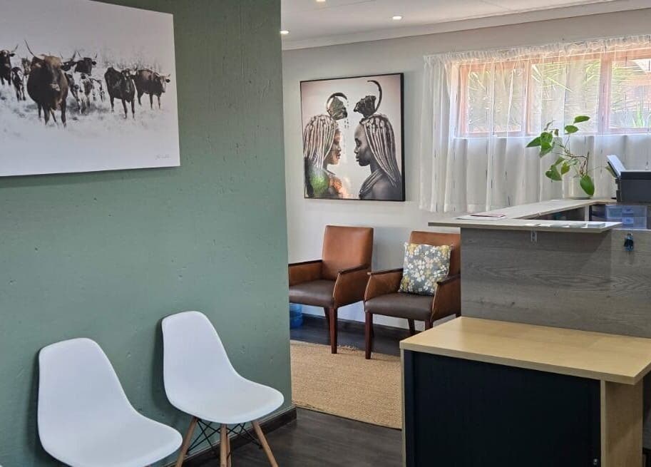 Cozy waiting area with art at Gerhard Shaw Physiotherapy, Pretoria, Gauteng, ZA.