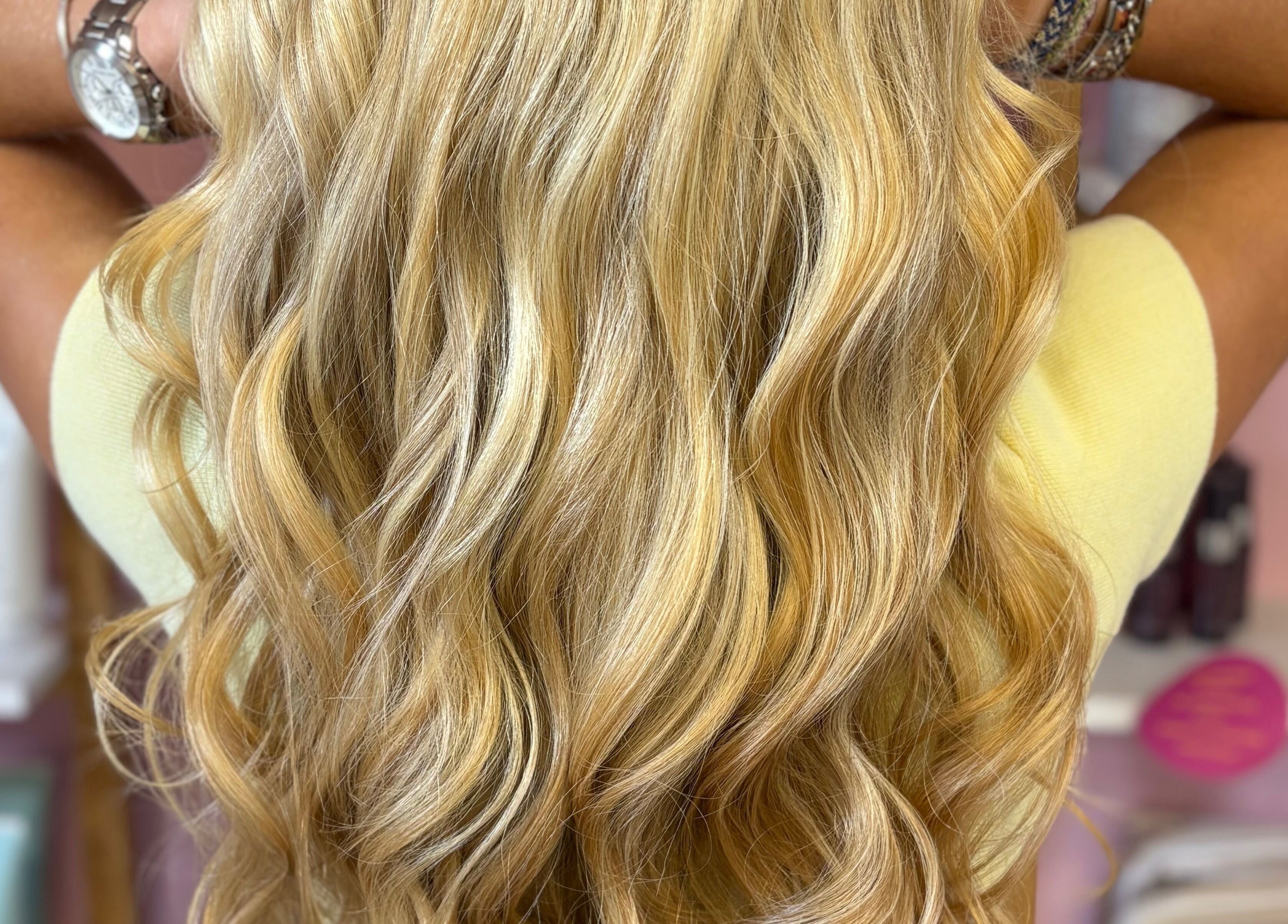Blonde wavy hair styled at Beverley @ Akina hair salon, Hull, England, GB showcases vibrant elegance and shine.