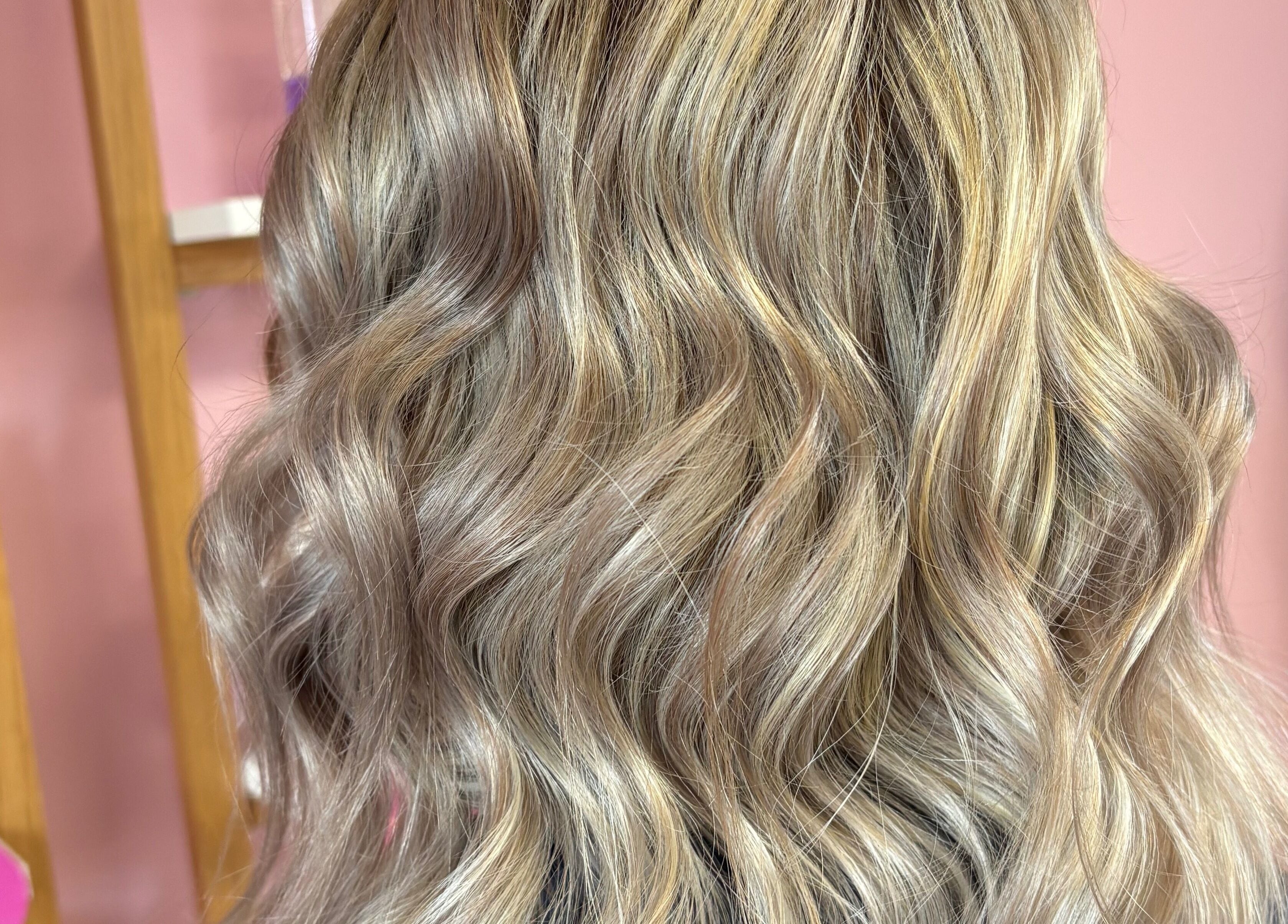 Beautiful wavy blonde hair styled at Beverley @ Akina hair salon in Hull, England, GB.