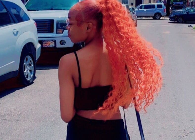 Model showcases vibrant hairstyle from slayedbyjaylamarie in Philadelphia, Pennsylvania, US.
