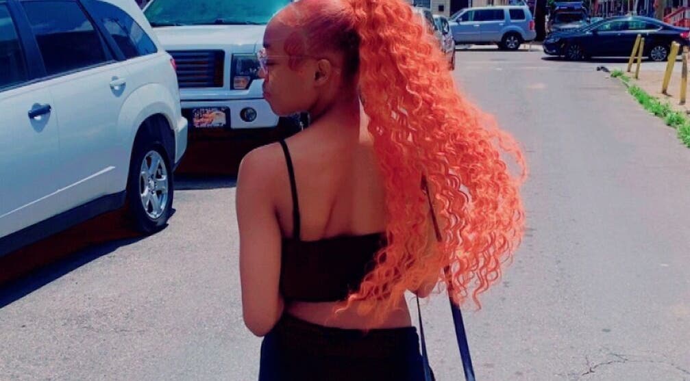 Model showcases vibrant hairstyle from slayedbyjaylamarie in Philadelphia, Pennsylvania, US.