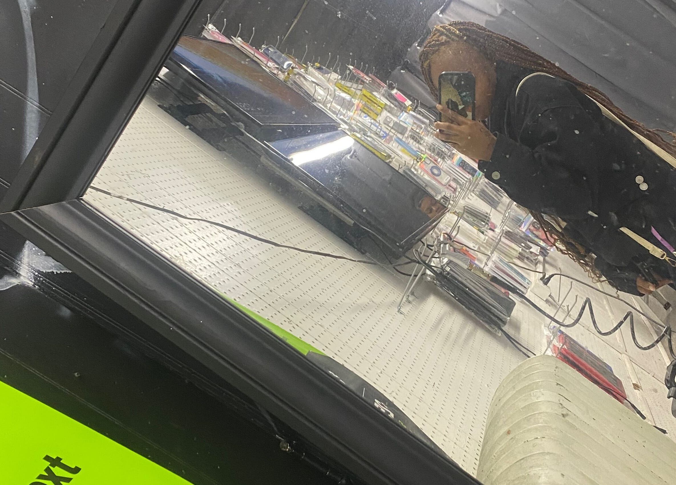 Client's reflection in mirror at slayedbyjaylamarie, Philadelphia, Pennsylvania, US